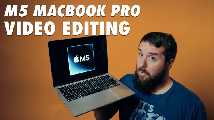 Matt Johnson holding an M5 Macbook for Video Editing