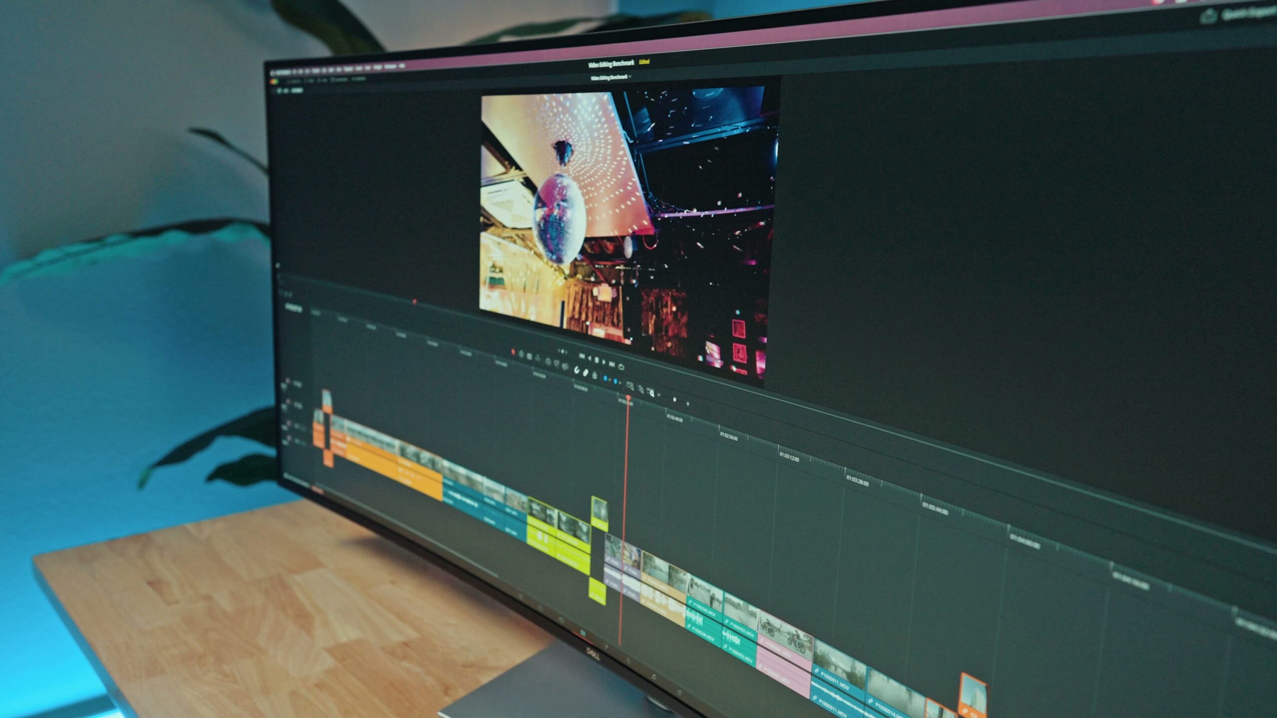 The Dell 52-inch ultrawide monitor showing a wide video editing timeline across the screen