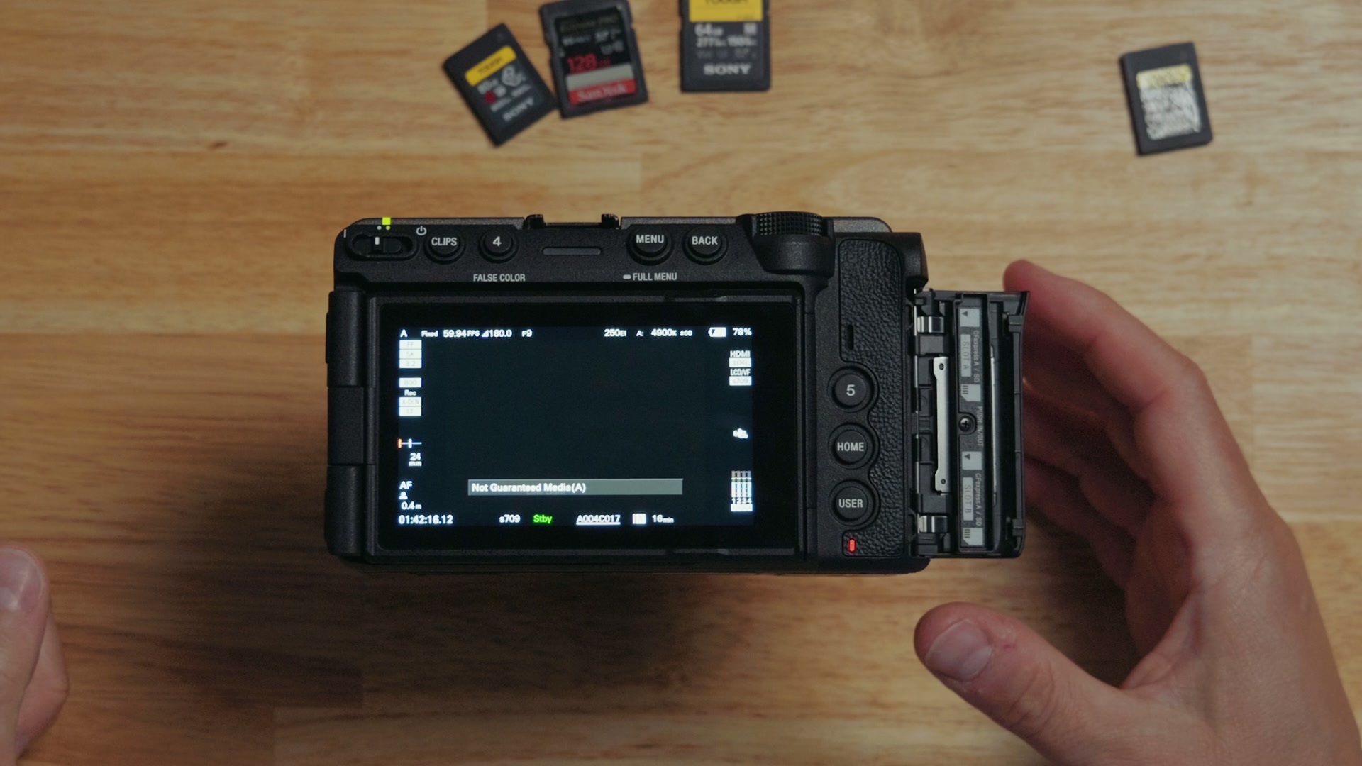 The Sony FX5 rear screen showing a Not Guaranteed Media (A) warning message after an SD card is inserted