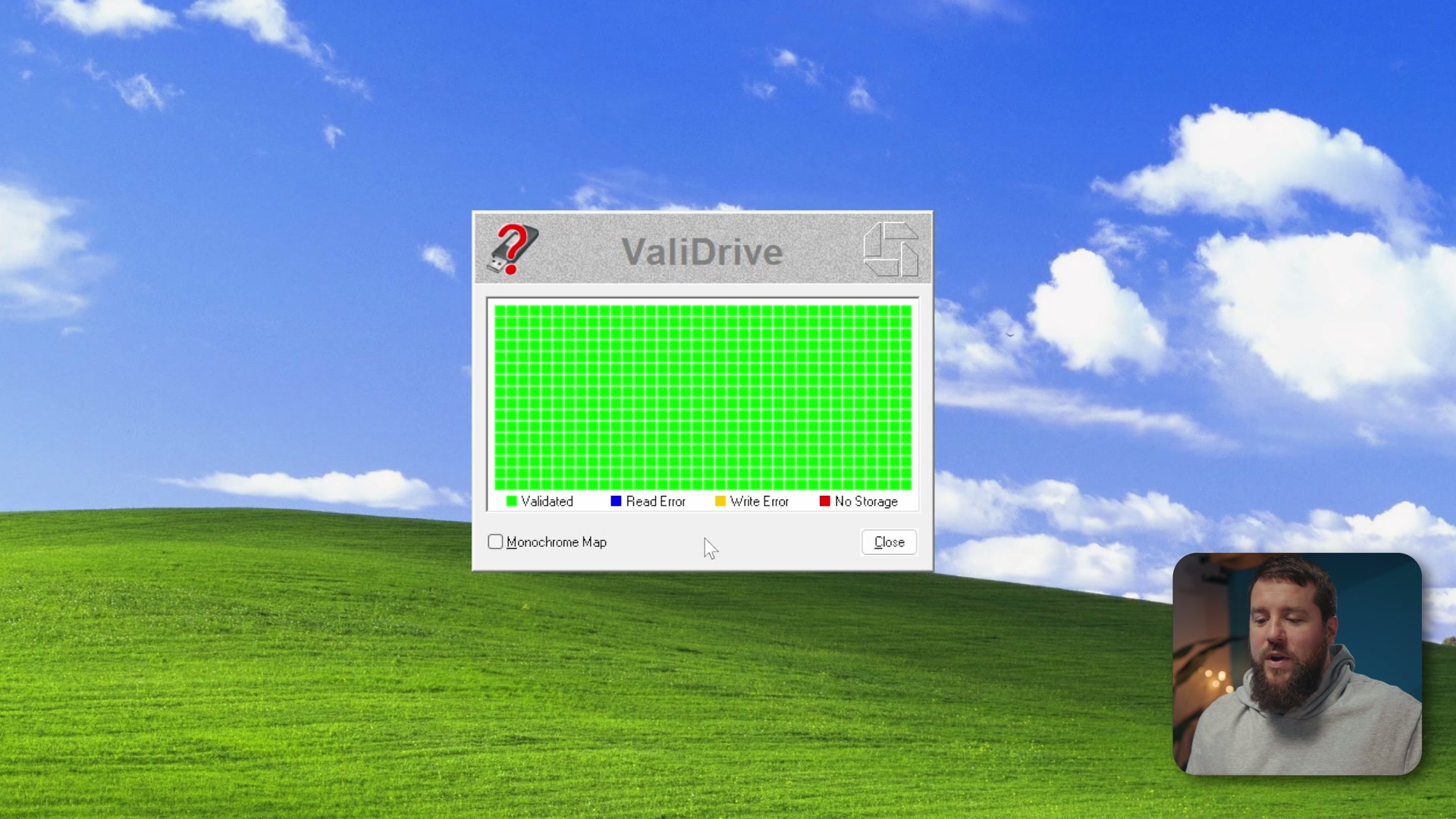 The ValiDrive app window showing a grid of squares filling in as it spot-checks regions of the memory card
