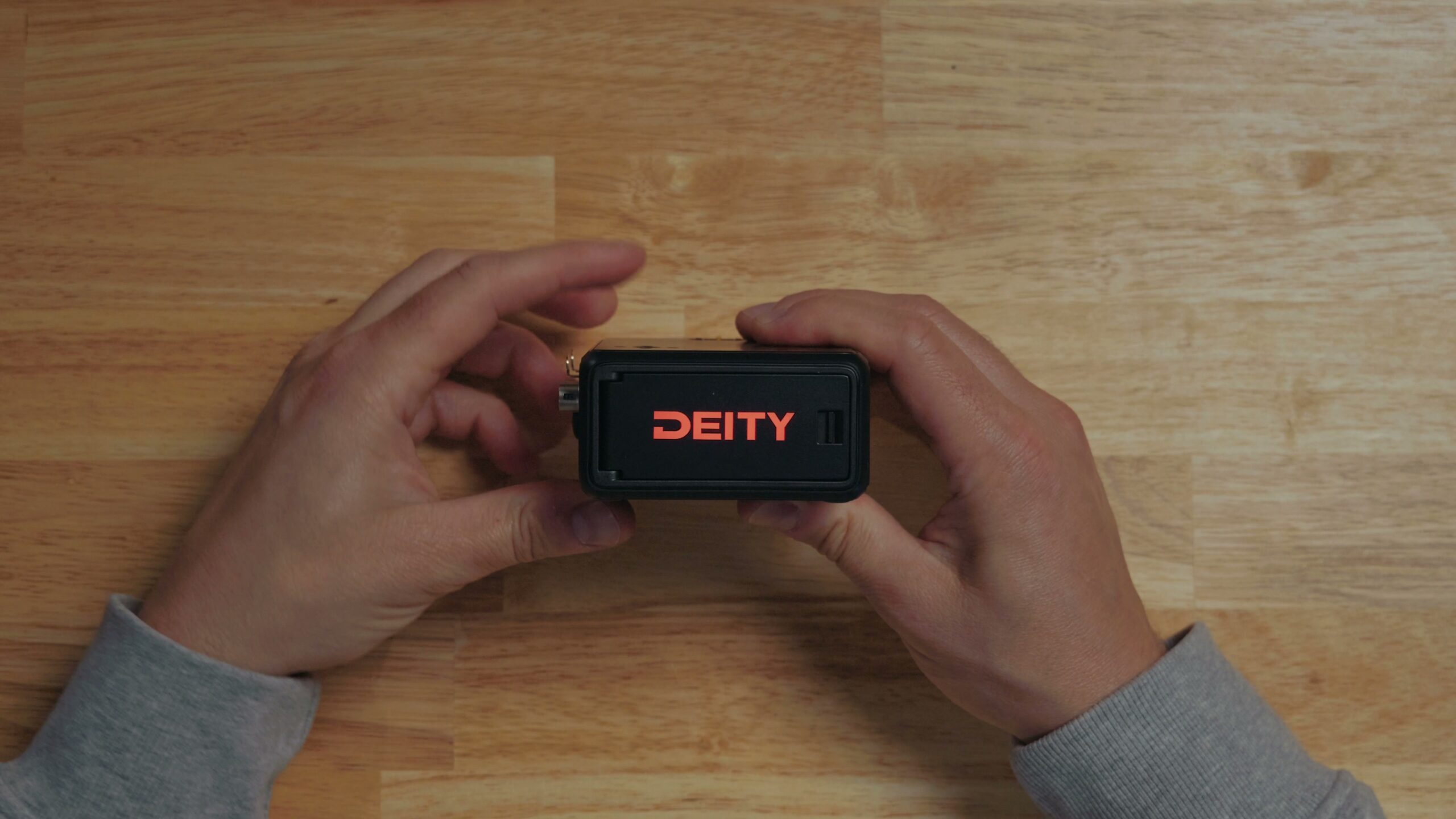 The back of the Deity PR4 with the logo lit up red as a tally light