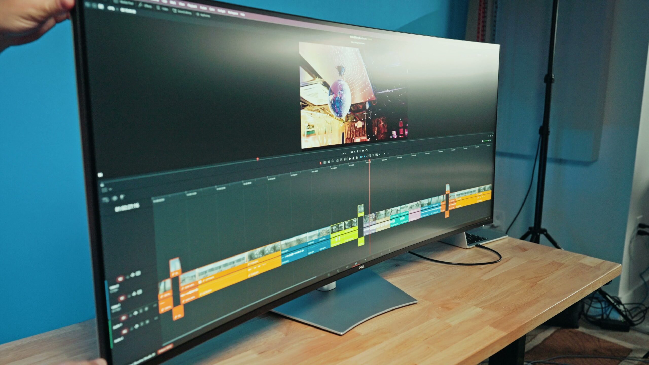 The Dell 52-inch ultrawide monitor sitting on its large height-adjustable stand