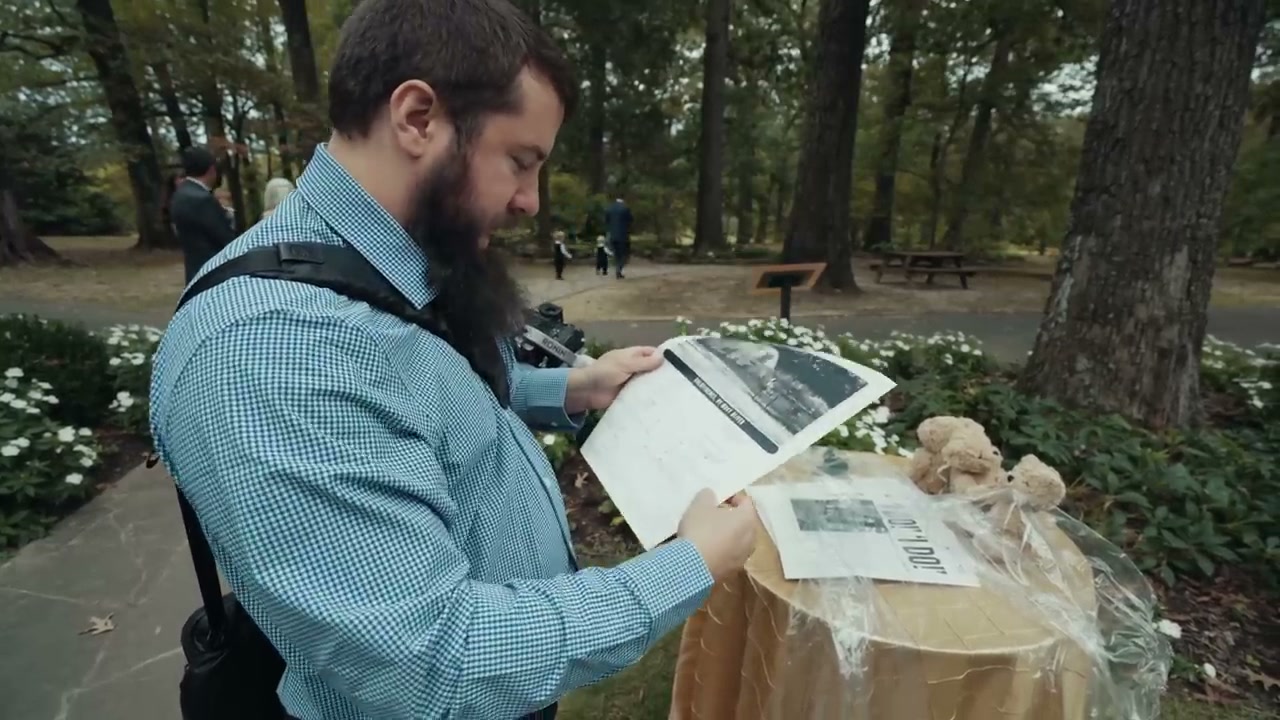 A custom printed newspaper made by the couple for their wedding, showing photos and articles