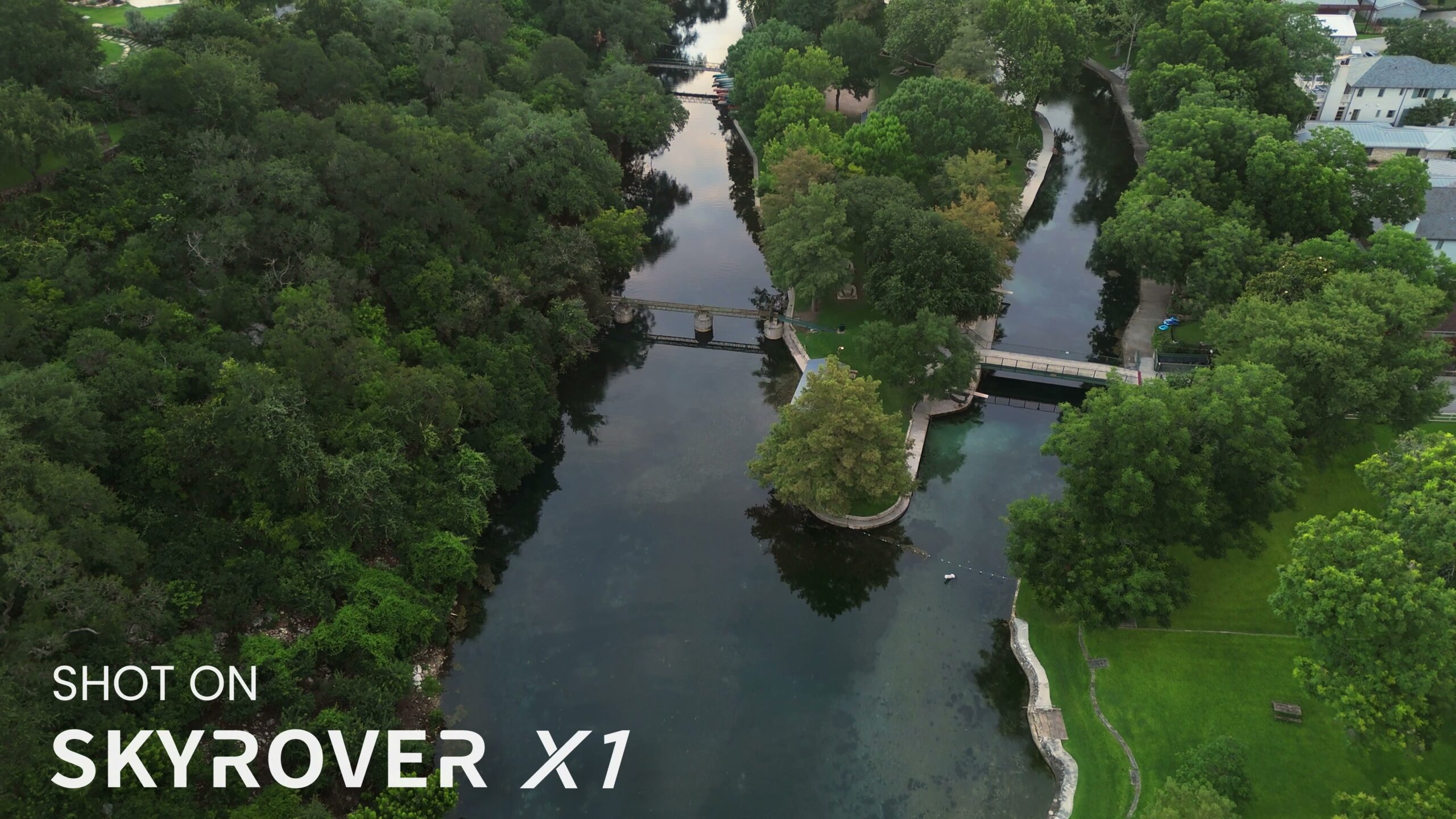Aerial footage from the SkyRover X1 showing colorful green summer trees