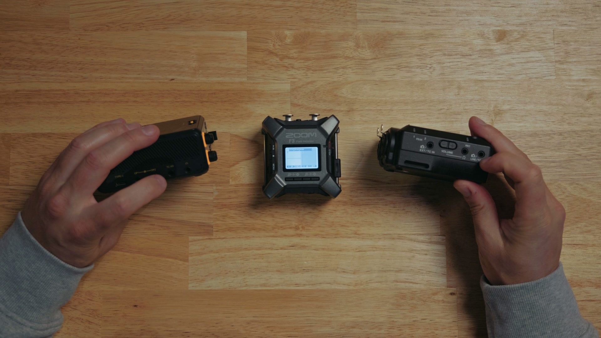 Close up of the 3.5 millimeter timecode input and output jacks on the Tascam FR-AV2 and Deity PR-4