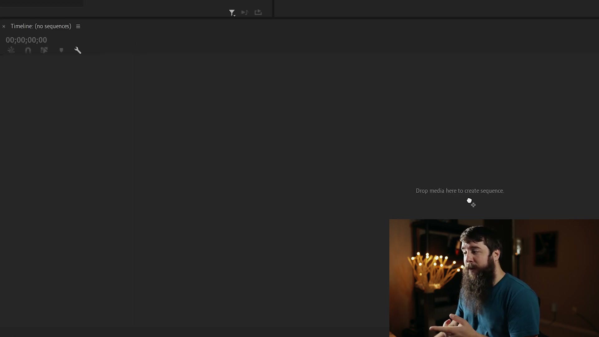 An empty Premiere Pro timeline panel showing the text Drop media here to create sequence.