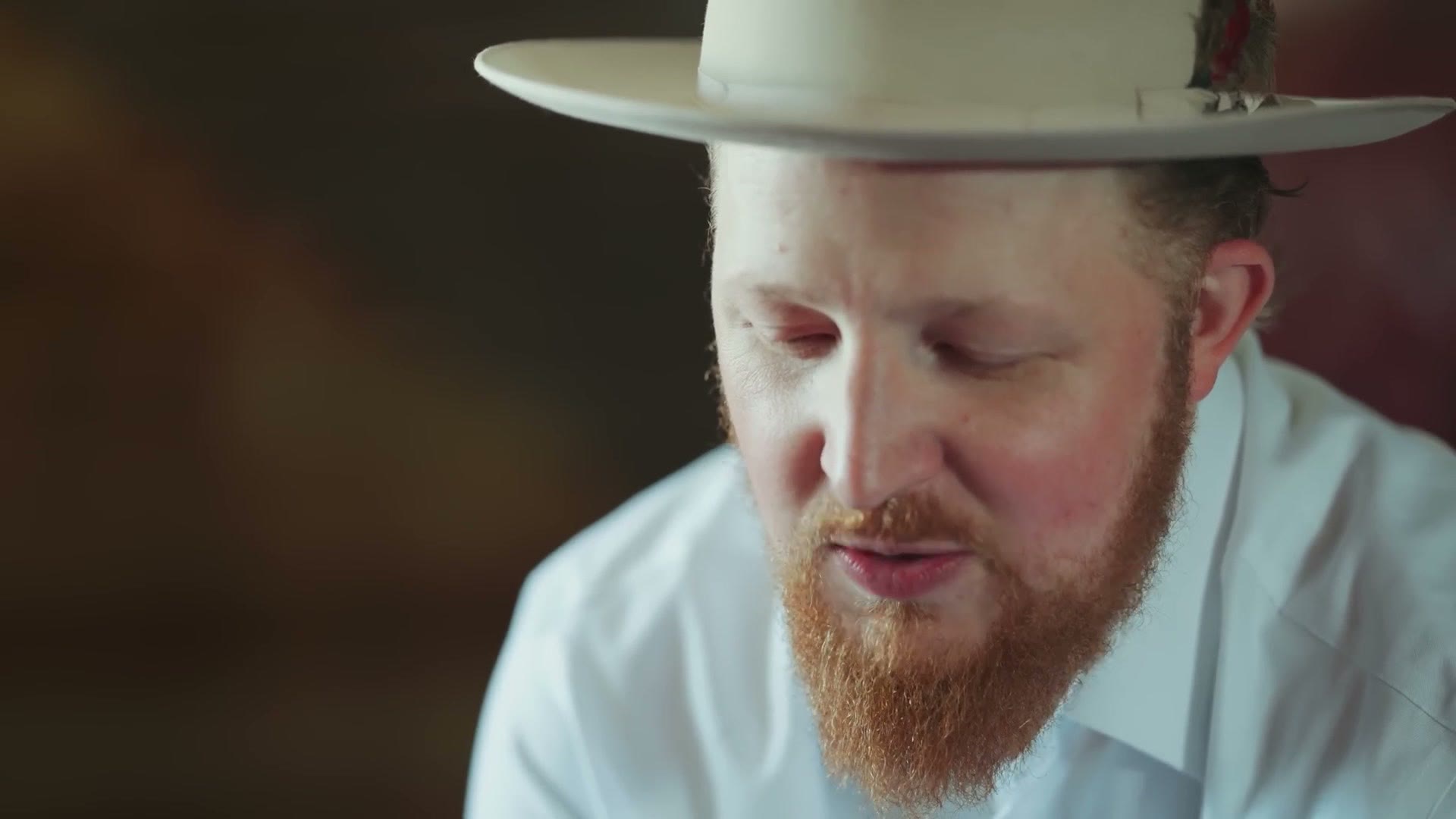 Head and shoulders portrait of a groom filmed on the Sony 135mm
