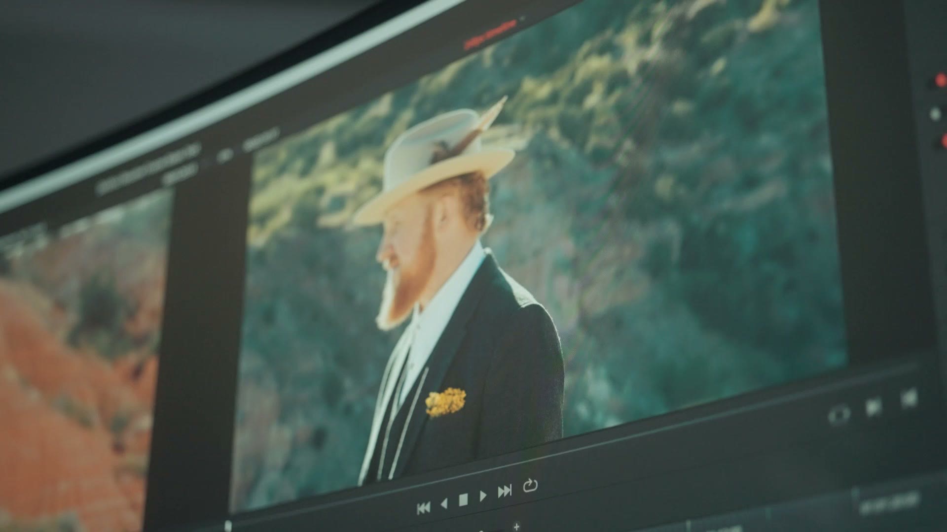 A 2.35:1 cinematic image filling the full width of the ultrawide monitor
