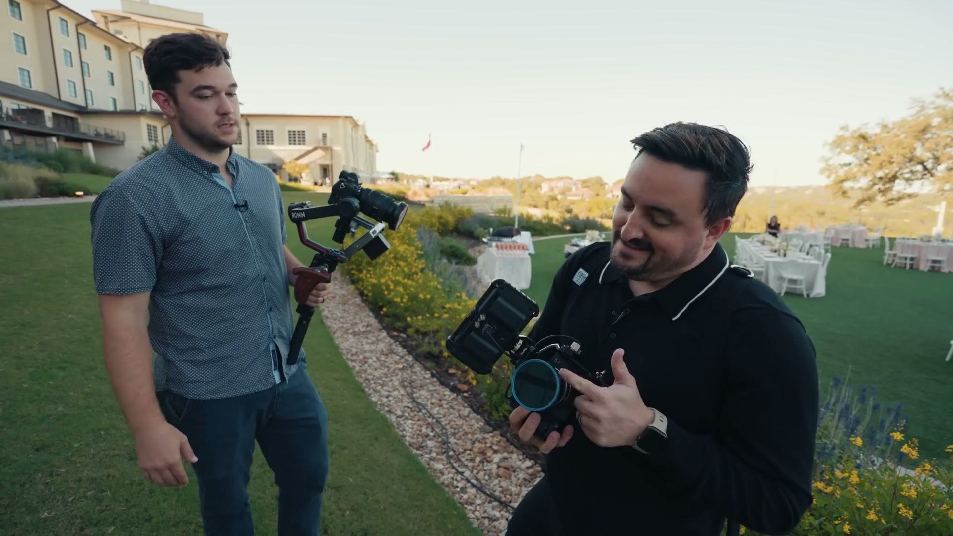 Aaron from 31Films holding a Sony camera fitted with a vintage Contax 50mm lens while another crew member holds a gimbal rig behind him