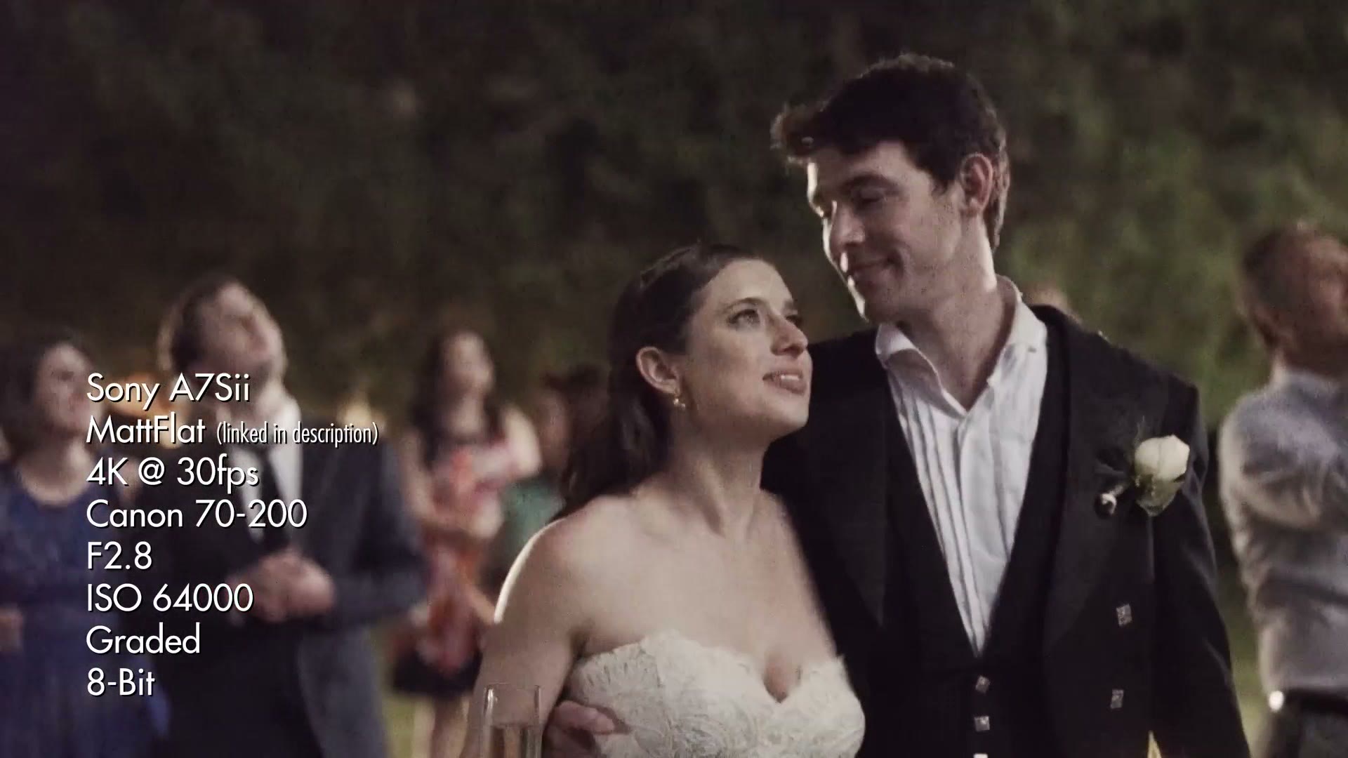 Night wedding reception frame of a couple, overlaid with settings reading Sony A7Sii, MattFlat, 4K at 30fps, Canon 70-200, F2.8, ISO 64000, graded, 8-bit