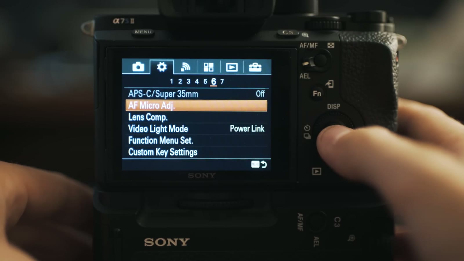 Gear submenu 6 showing APS-C/Super 35mm, Lens Compensation and Video Light Mode
