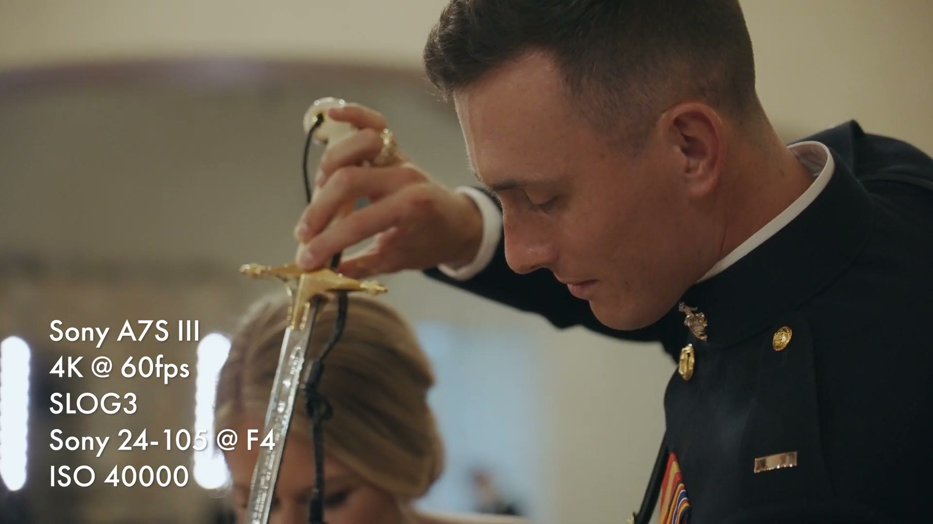 Dark wedding reception cake cutting with a sword, overlay reading Sony a7S III, 4K 60fps, SLOG3, Sony 24-105 at F4, ISO 40000