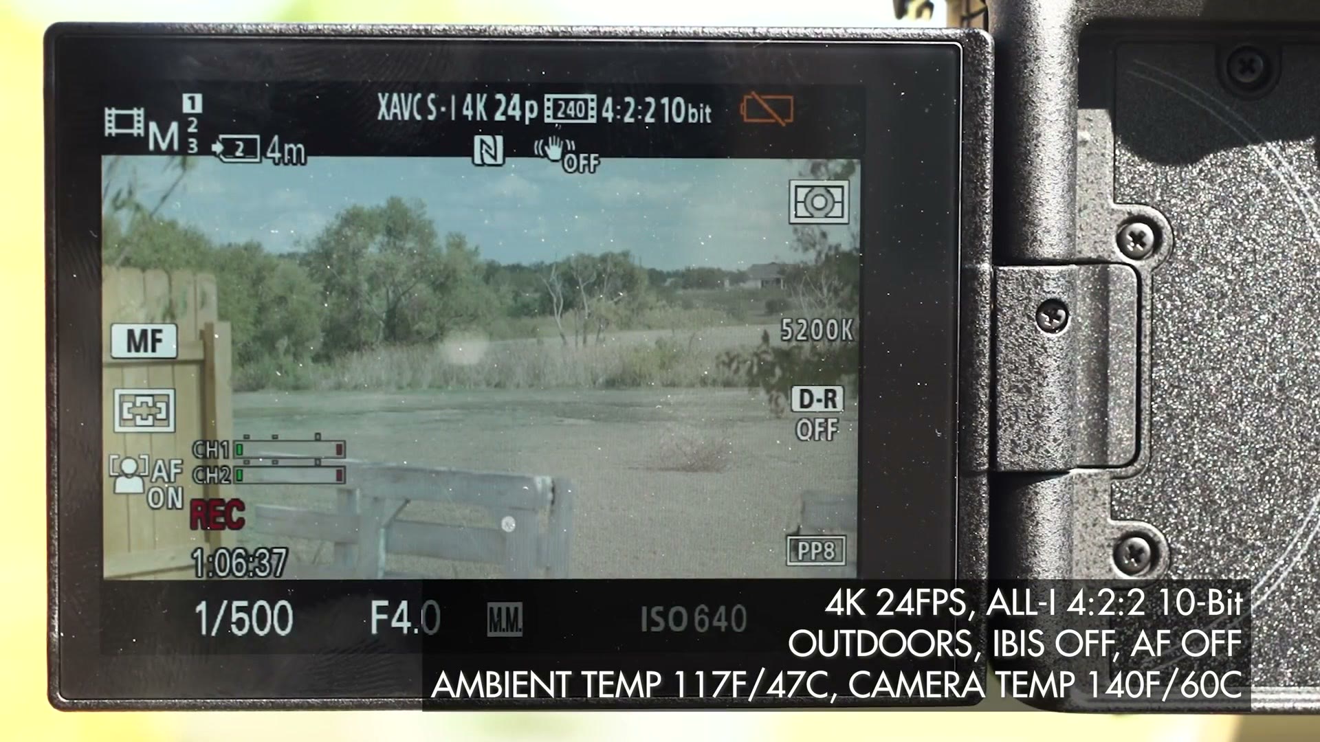 The a7S III rear screen outdoors recording XAVC S-I 4K 24p at a one hour six minute mark, with an overlay reading 4K 24FPS ALL-I, outdoors, IBIS off, AF off, ambient temp 117F, camera temp 140F