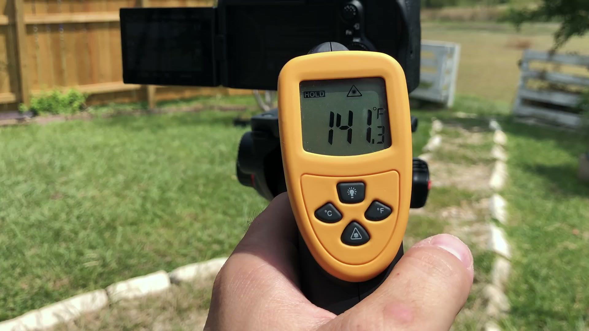 An infrared thermometer pointed at the back of the a7S III reading 141.3 degrees Fahrenheit
