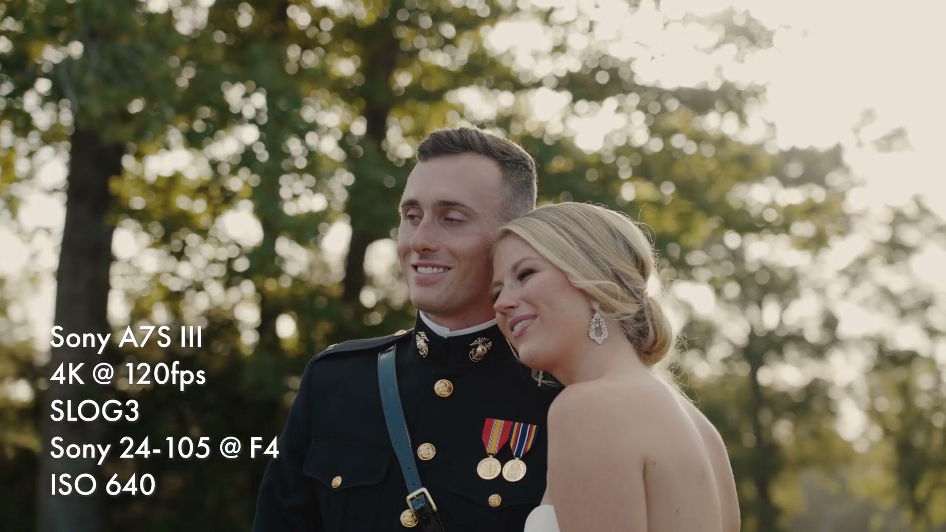 A groom in Marine dress uniform and a bride leaning together in backlit golden hour light, overlay reading Sony A7S III, 4K at 120fps, SLOG3, Sony 24-105 at F4, ISO 640