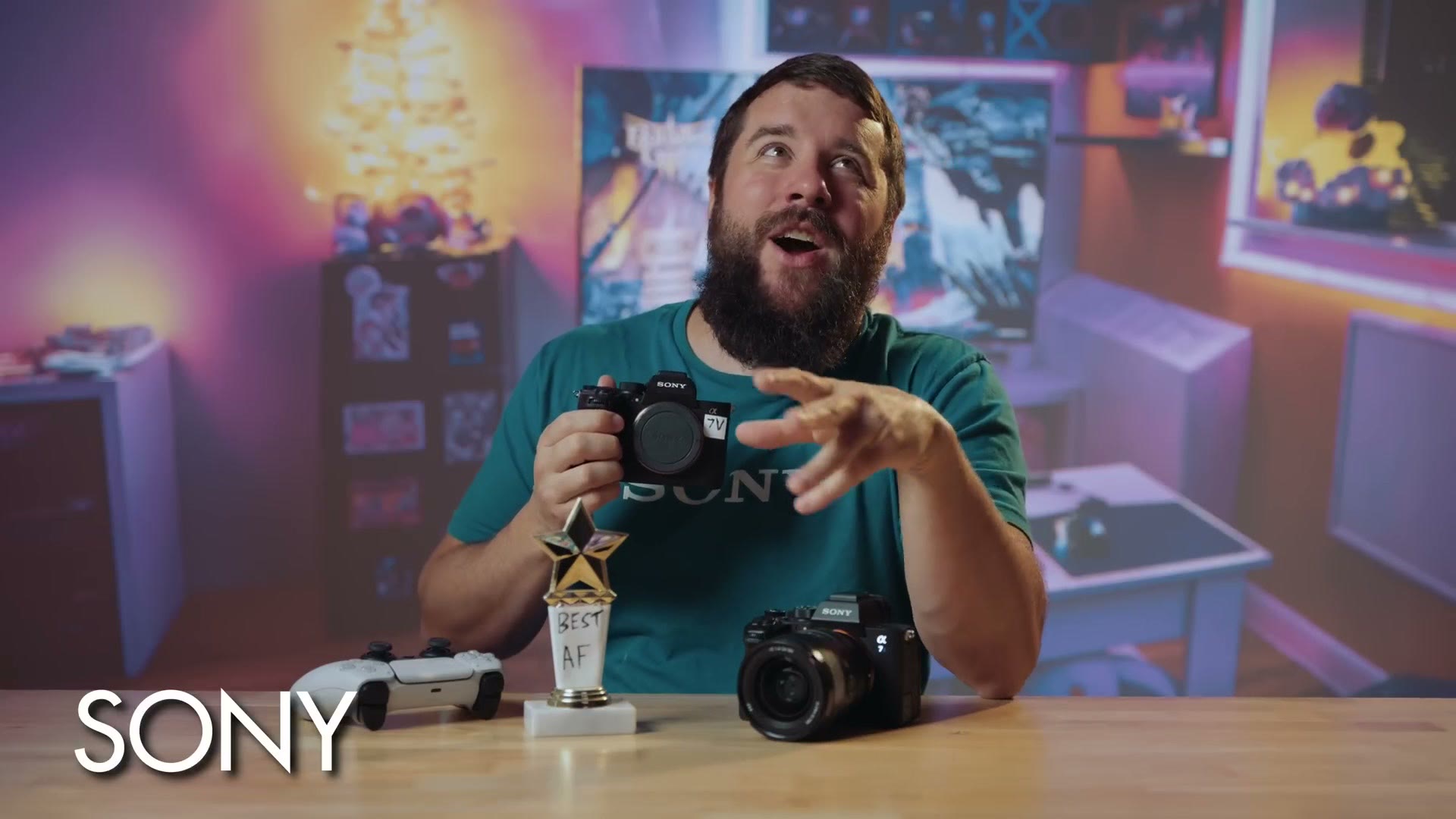 Matt in a Sony shirt in a games room holding an Alpha body, with a trophy labelled Best AF on the desk, captioned SONY