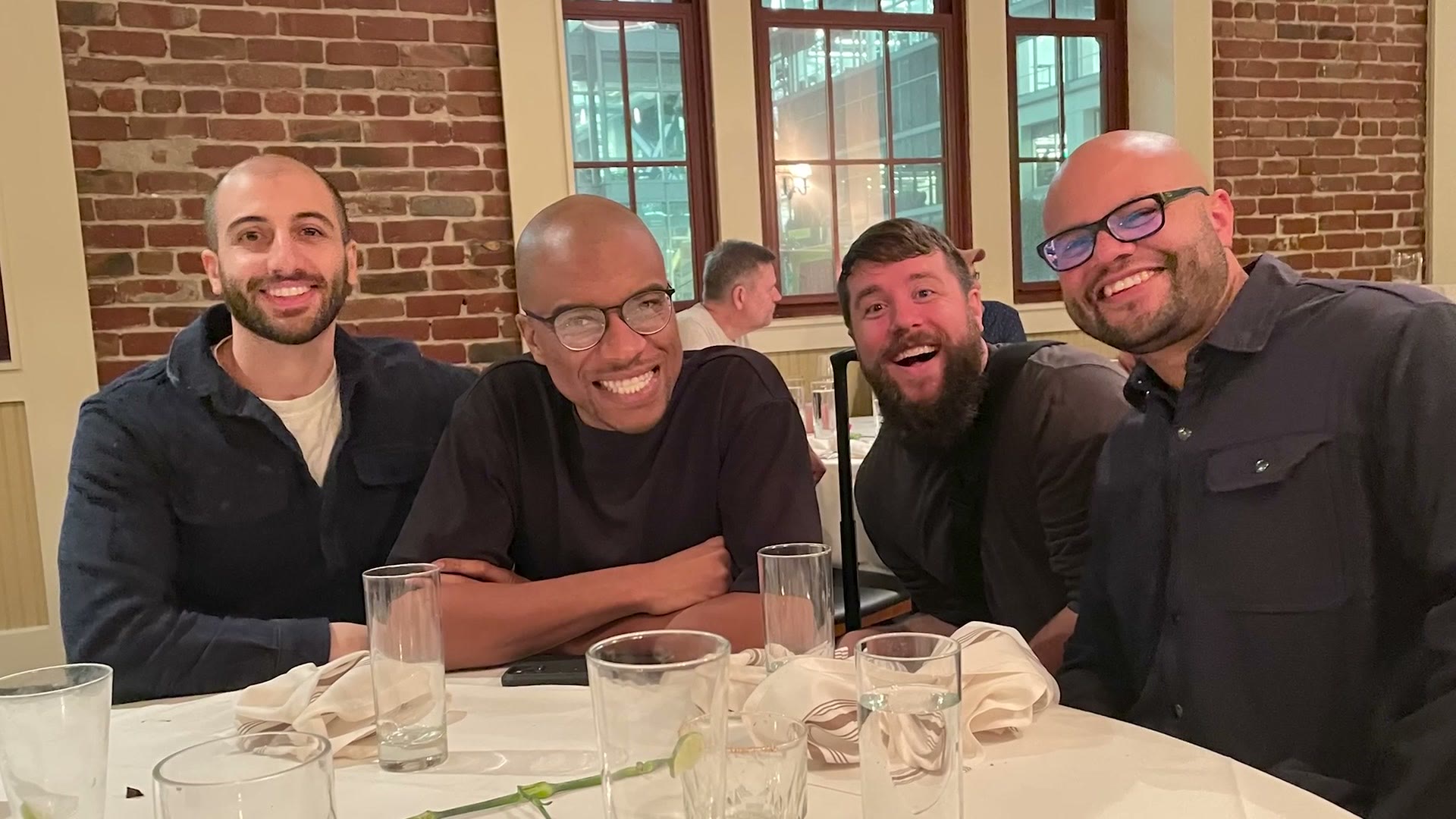 Group photo of the video editors Adobe flew out to San Francisco, sitting at a dinner table