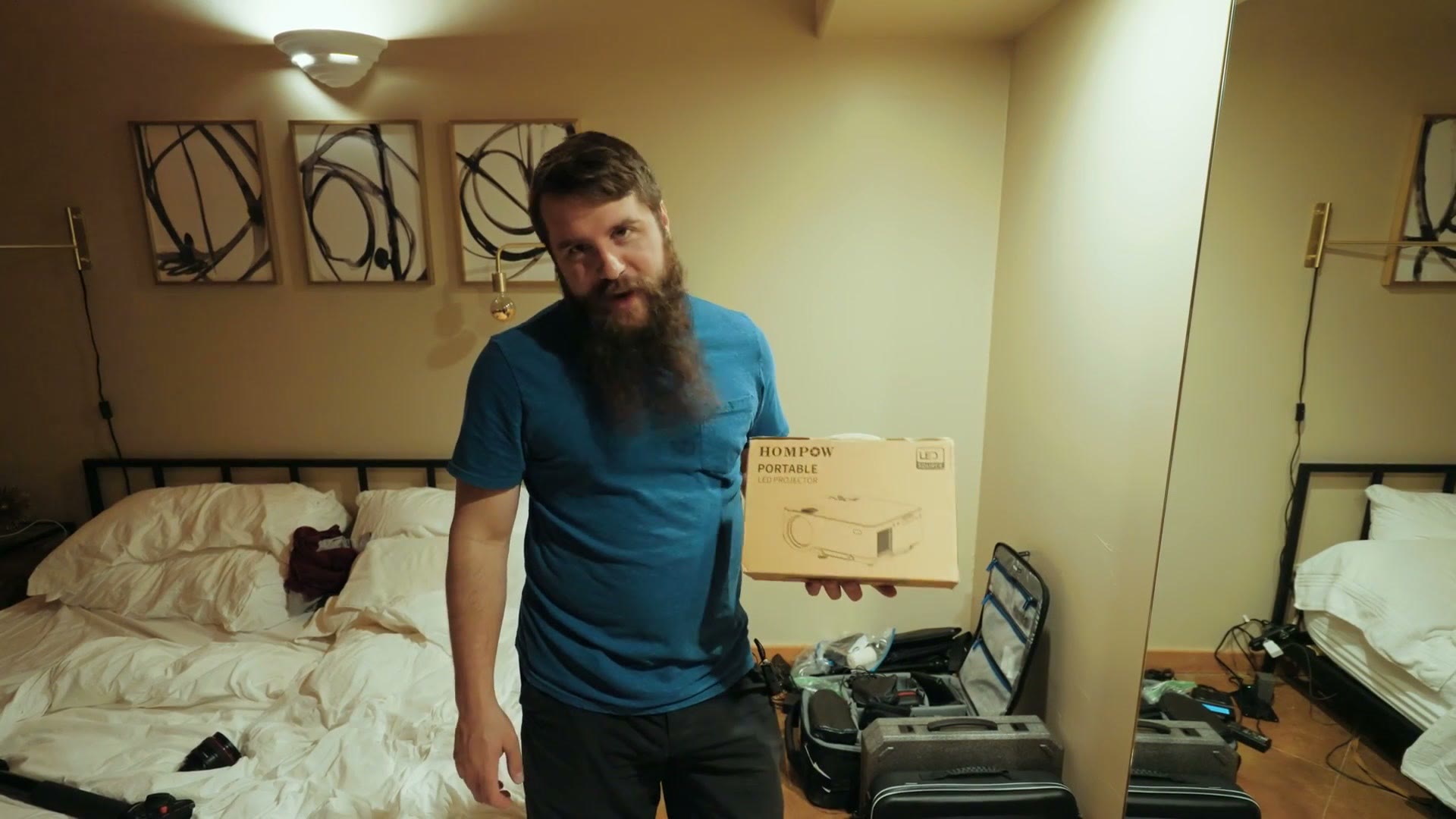 Matt Johnson holding a projector box he bought on Amazon