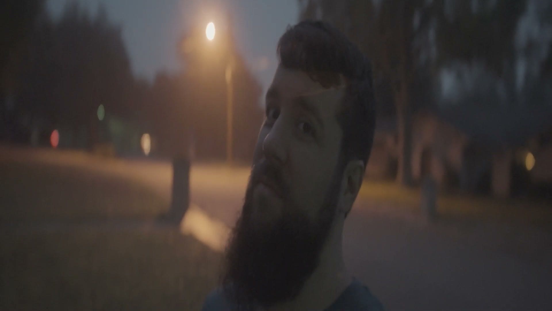 Horizontally squeezed anamorphic footage of Matt Johnson walking at dusk