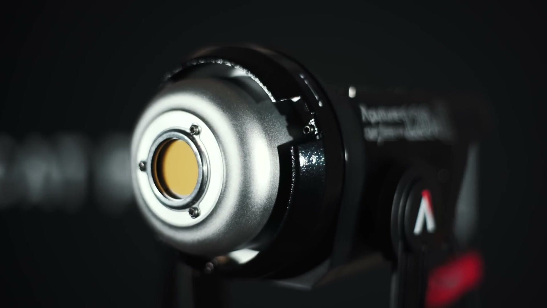 Close-up of the front of the Aputure 120D II with the small beauty dish fitted, leaving the COB LED chip exposed in the centre.
