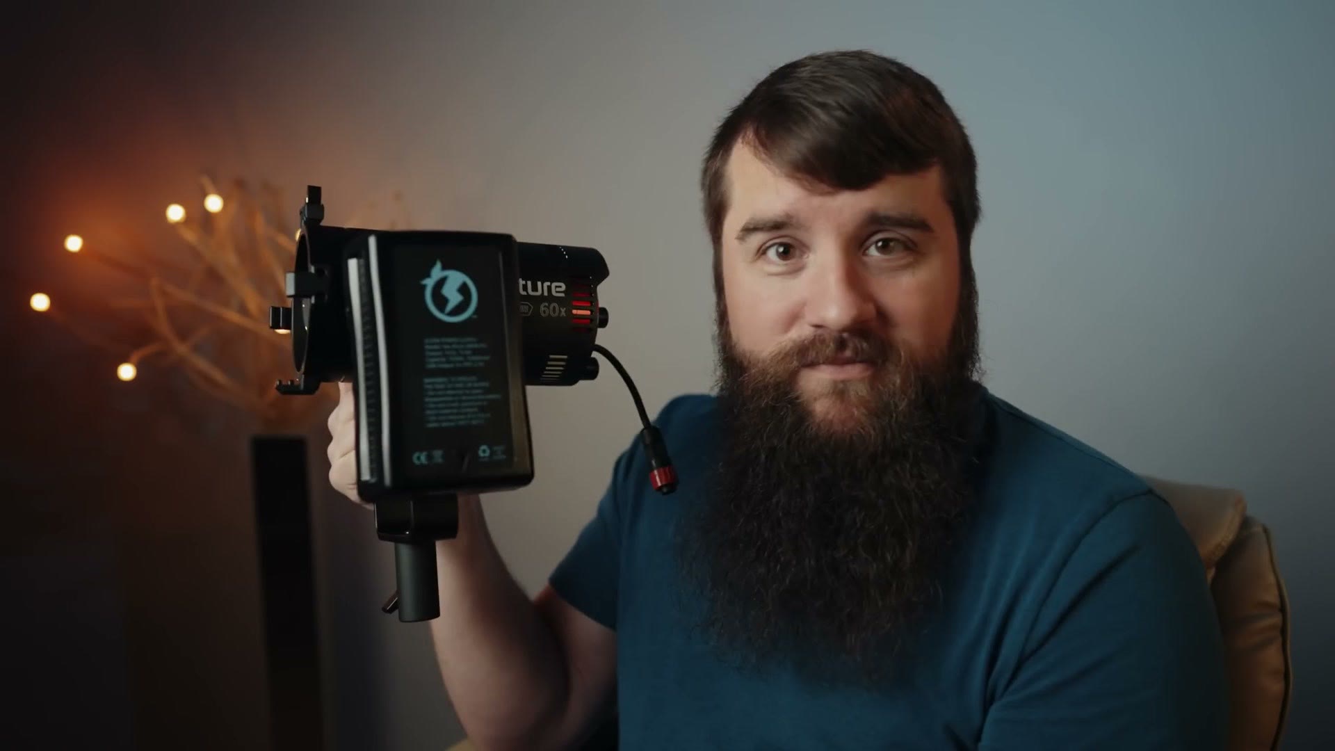 A V-mount battery slid onto the battery plate built into the yoke of the Aputure 60x.