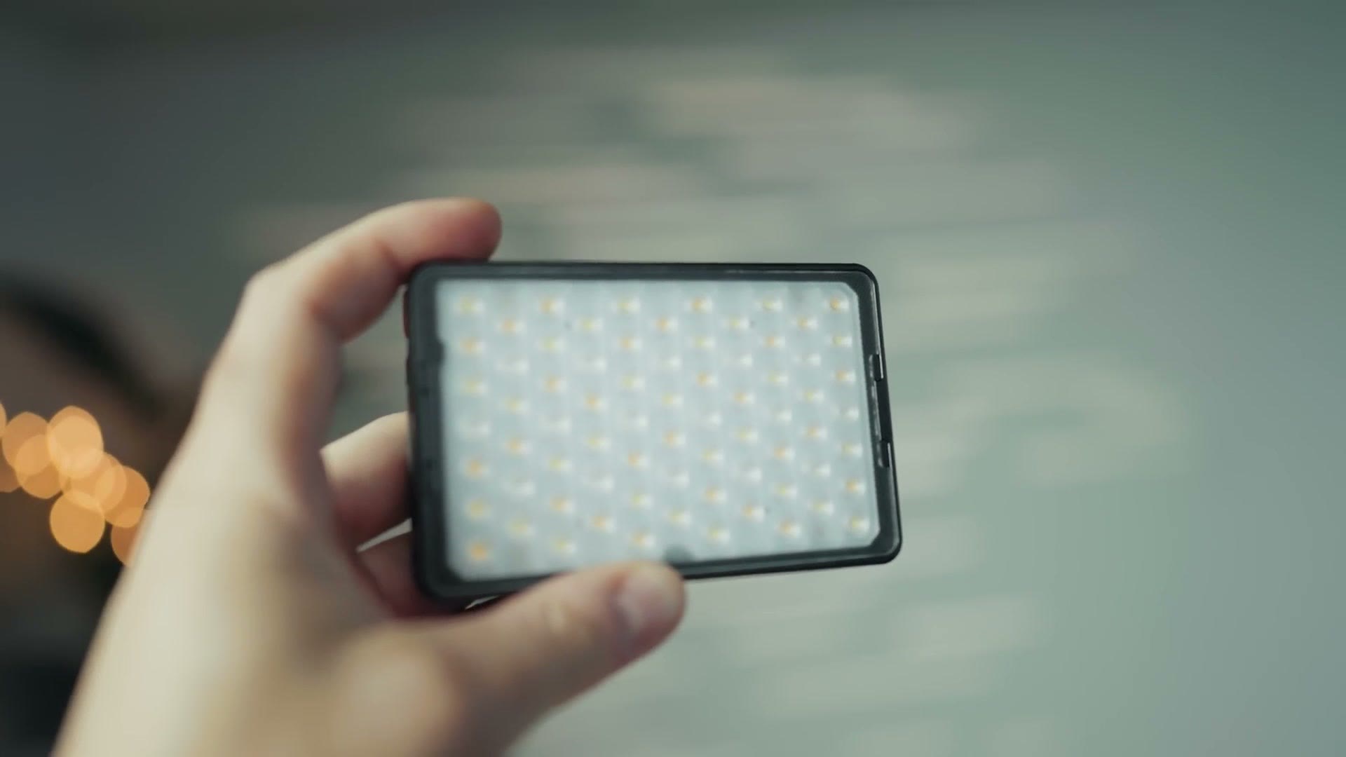 Matt Johnson holding the Aputure MC Pro in one hand to show its size