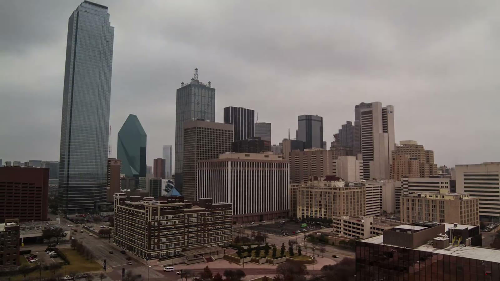 Aerial drone view of the Dallas skyline on an overcast day, Bank of America Plaza tower on the left