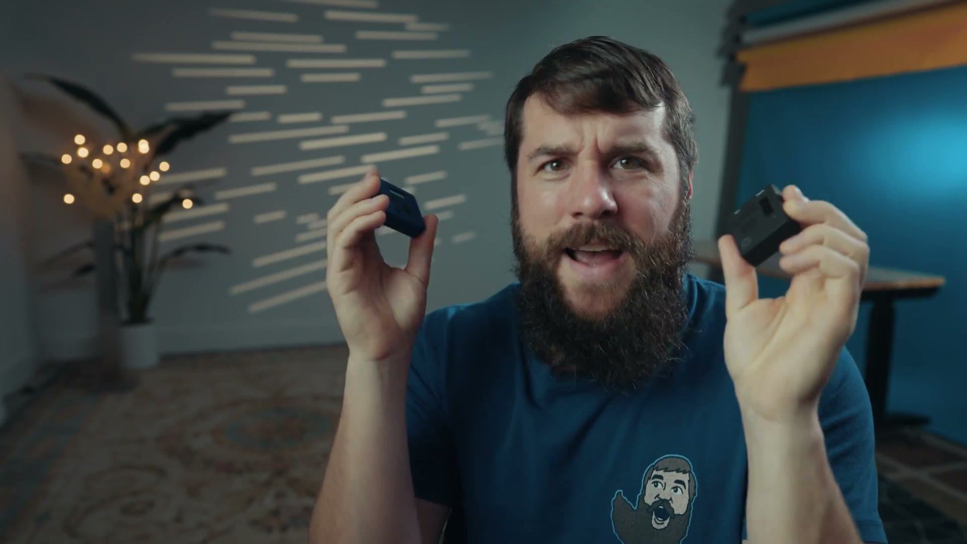 The Atomos UltraSync BLUE and UltraSync ONE held one in each hand