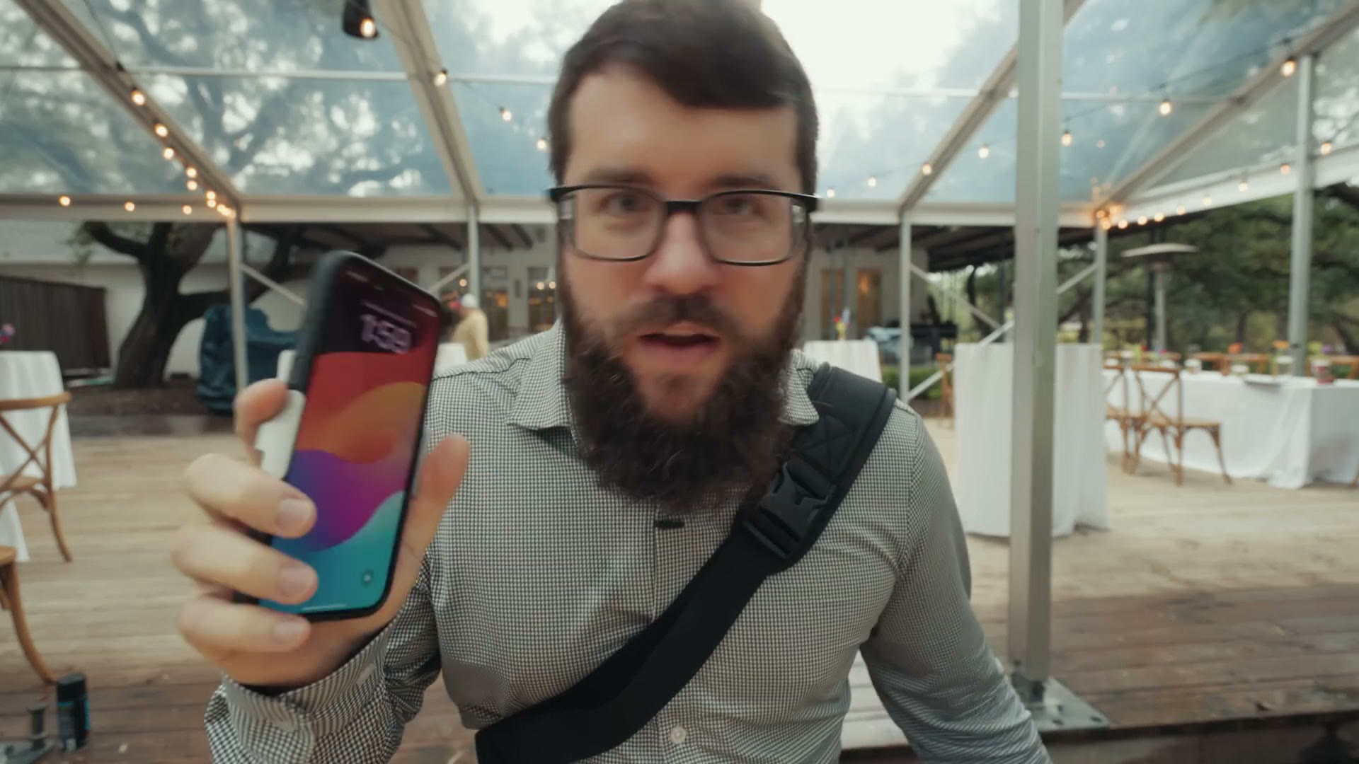 Matt holding up the iPhone 15 Pro Max running the Blackmagic Camera app