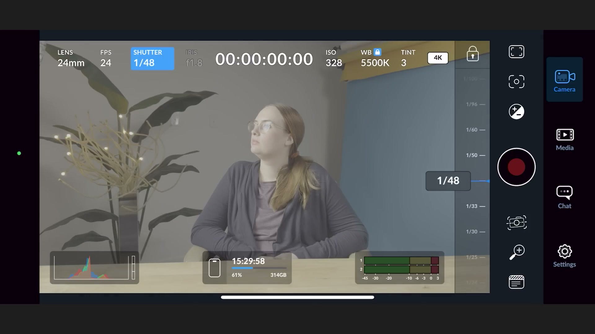The Blackmagic Camera app with shutter speed locked to 1/48 and ISO showing 320