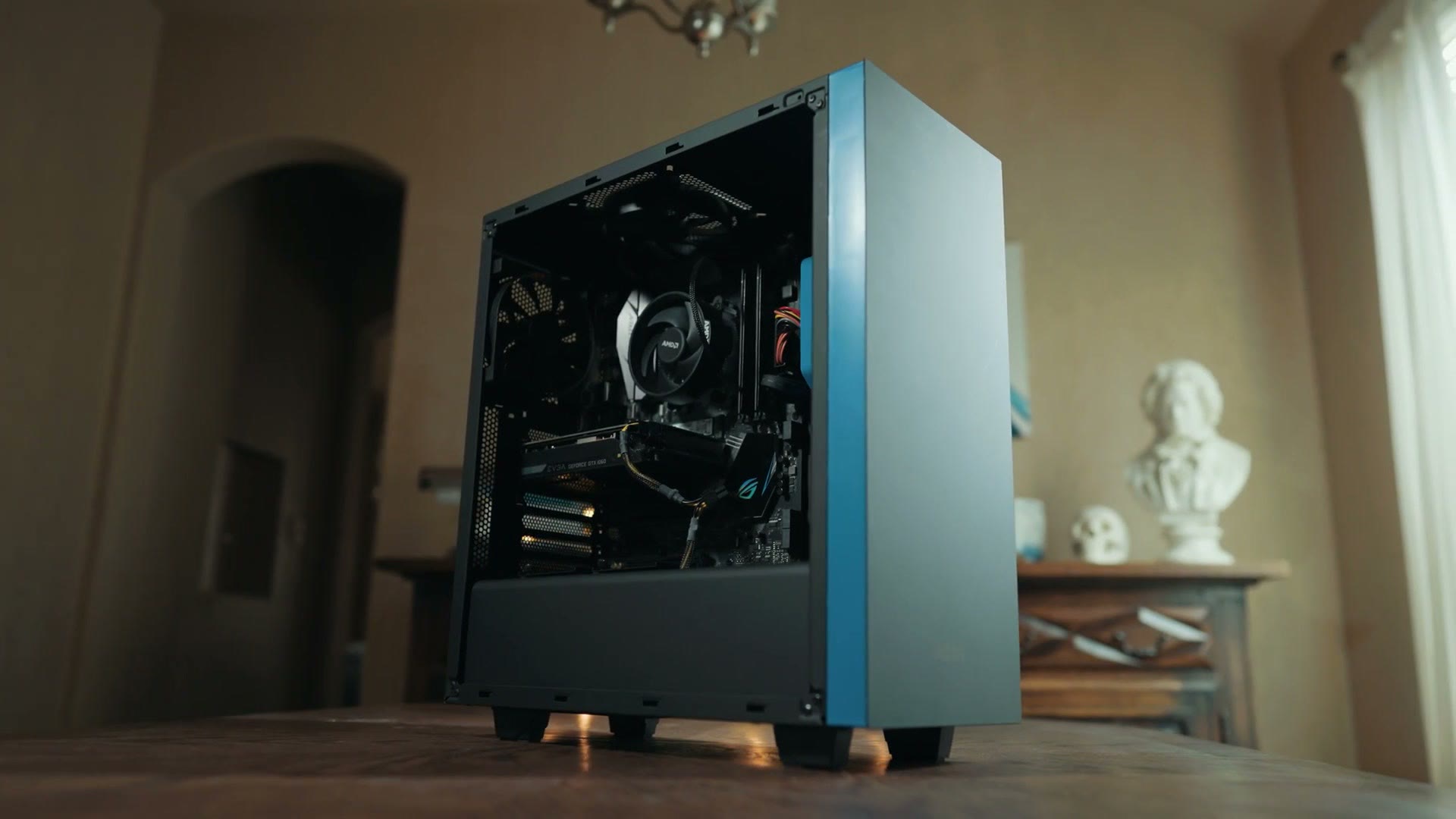 A finished budget video editing PC in a black mid tower case