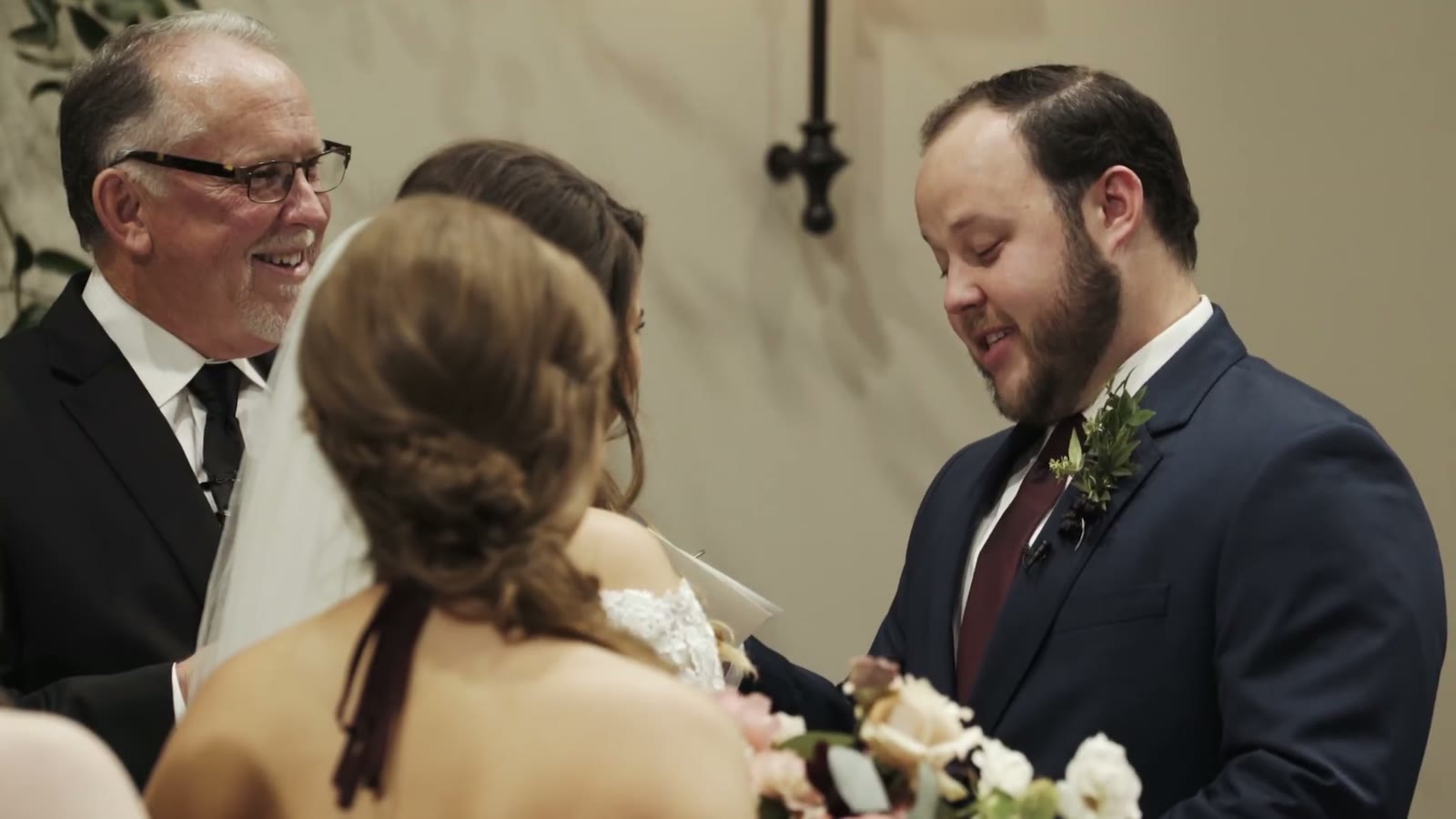 The ceremony, with the groom's father officiating beside the couple