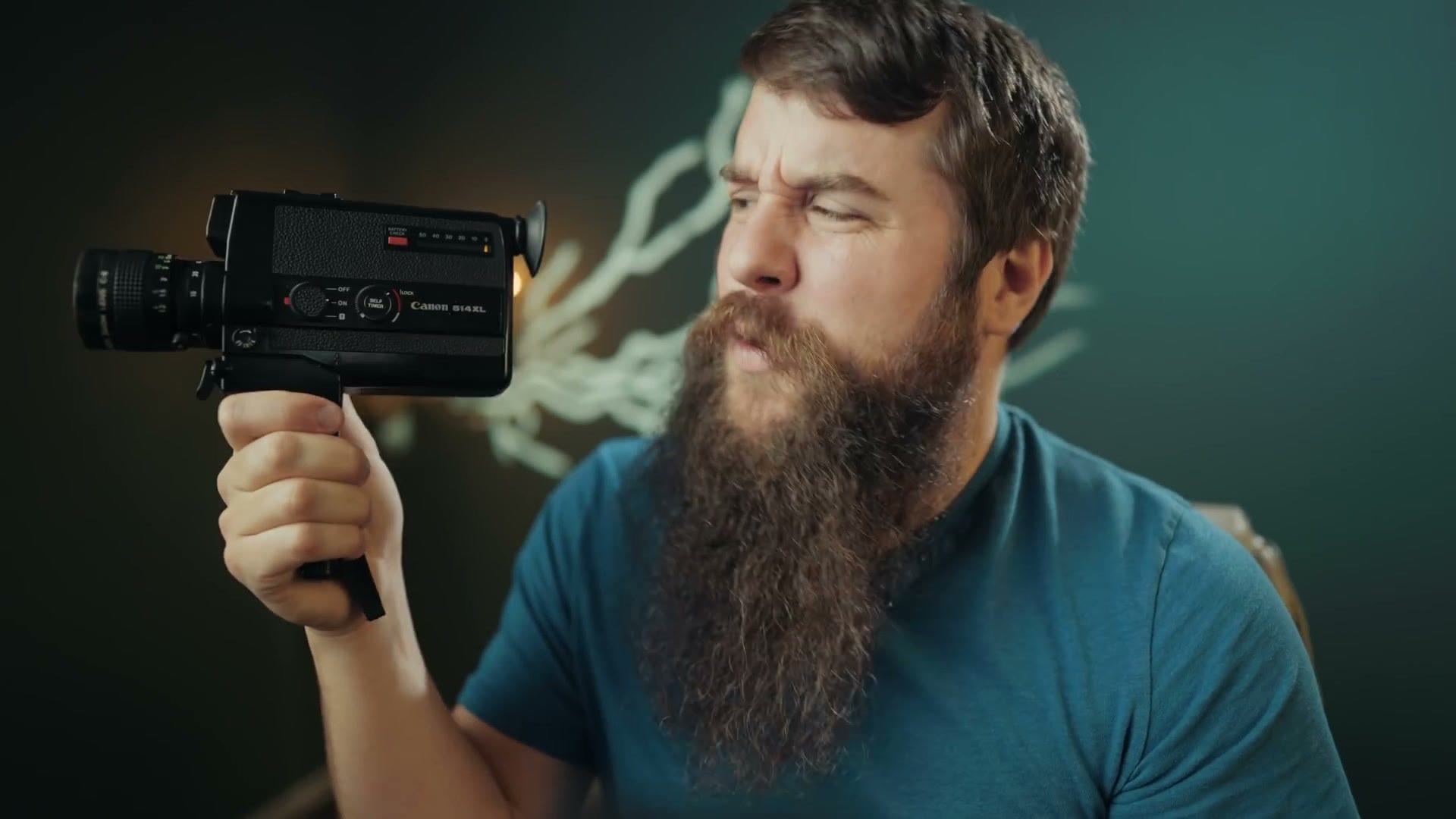 A Canon Super 8 film camera held in hand