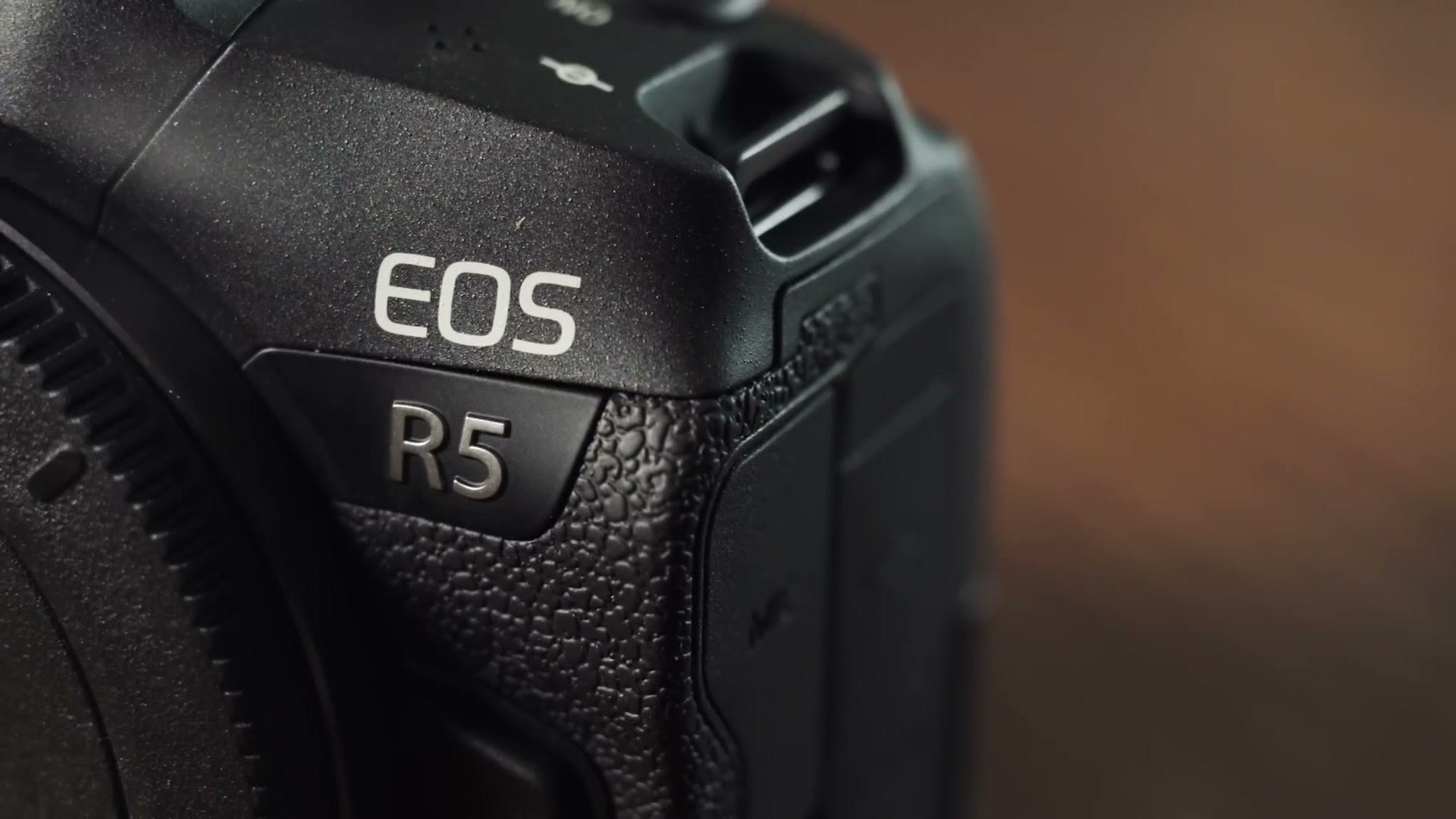 Close up of the EOS R5 badge on a Canon mirrorless camera body