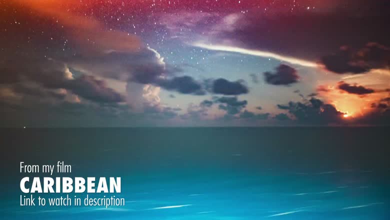 A Caribbean sunset over open water with stars appearing in the purple sky above the clouds, captioned as being from the film Caribbean