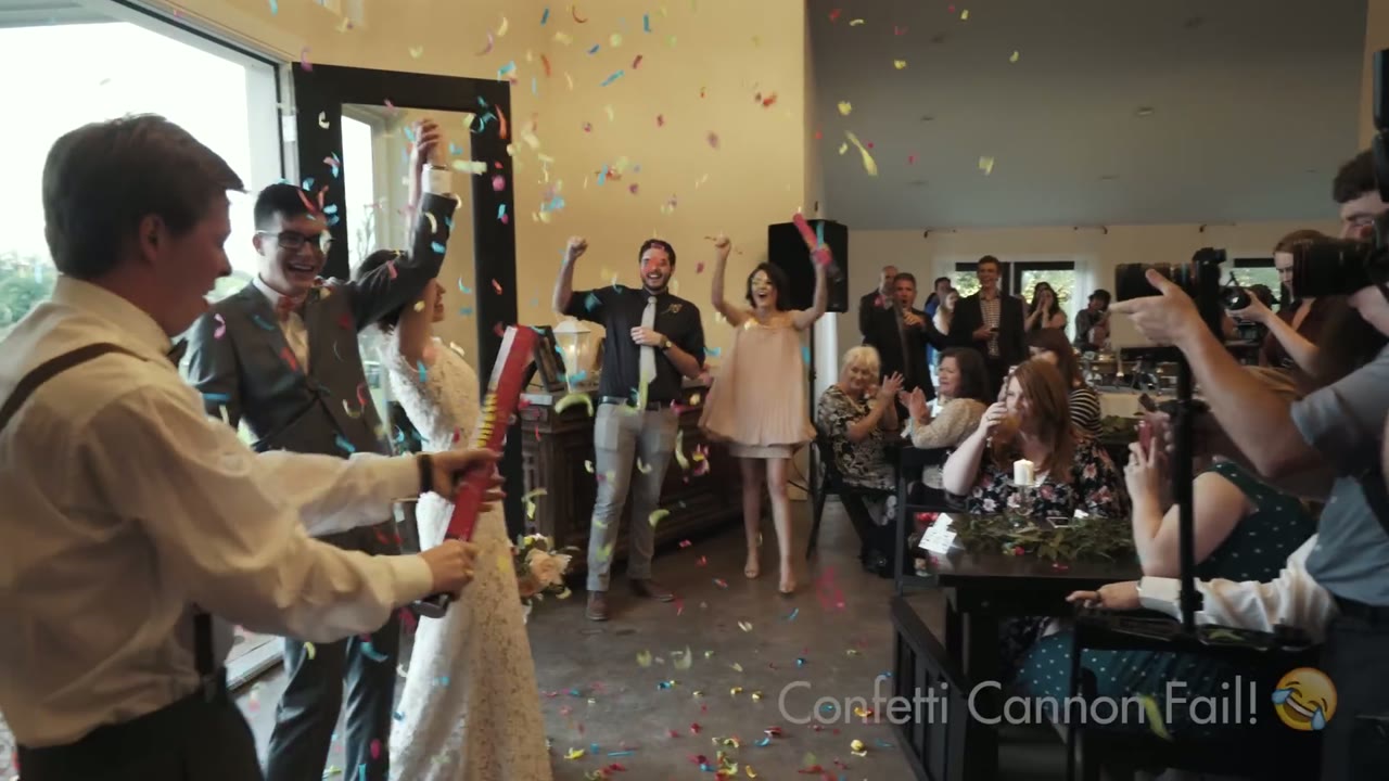 Confetti bursting over a bride and groom indoors as guests cheer, on-screen caption reading Confetti Cannon Fail!