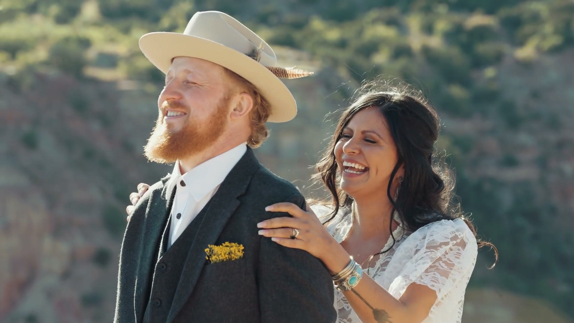The couple laughing together after the vows