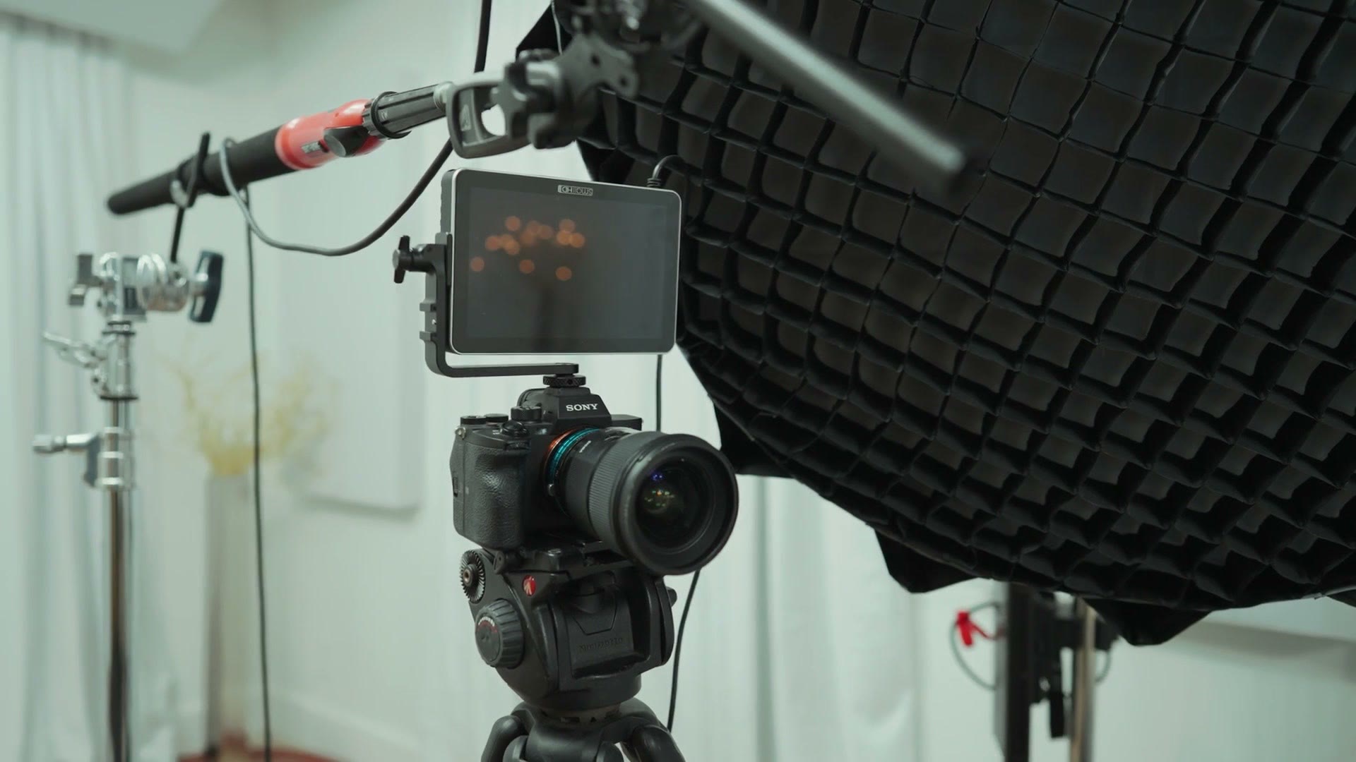The Deity S-Mic 2 on a boom arm above the camera