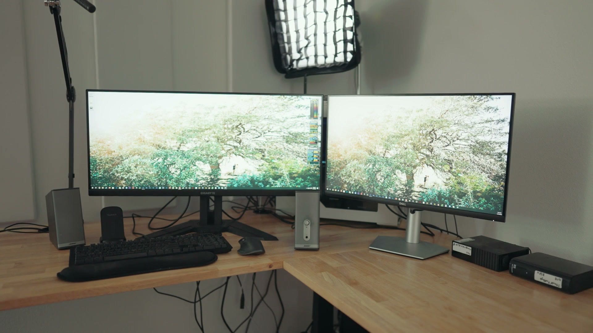The Dell U4025QW as part of a desk setup with a second monitor