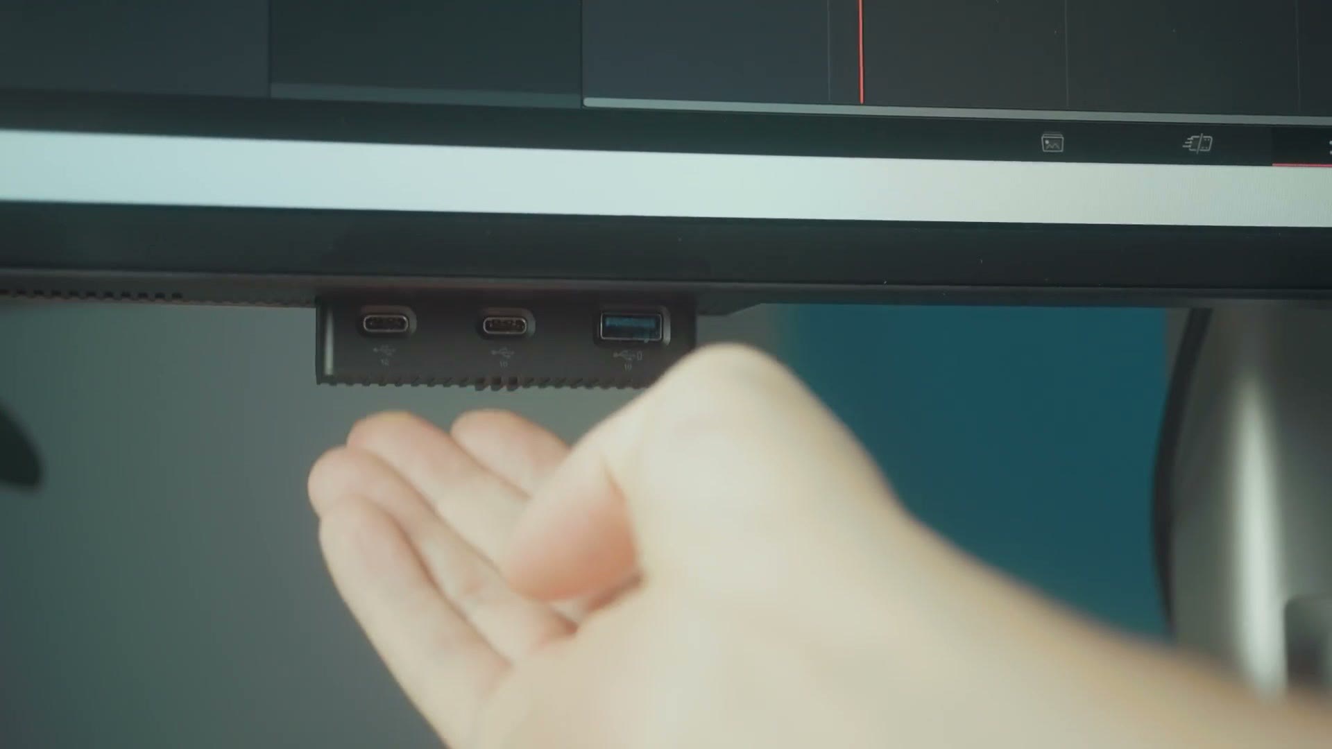 The hidden slide out USB panel on the front of the Dell U4025QW