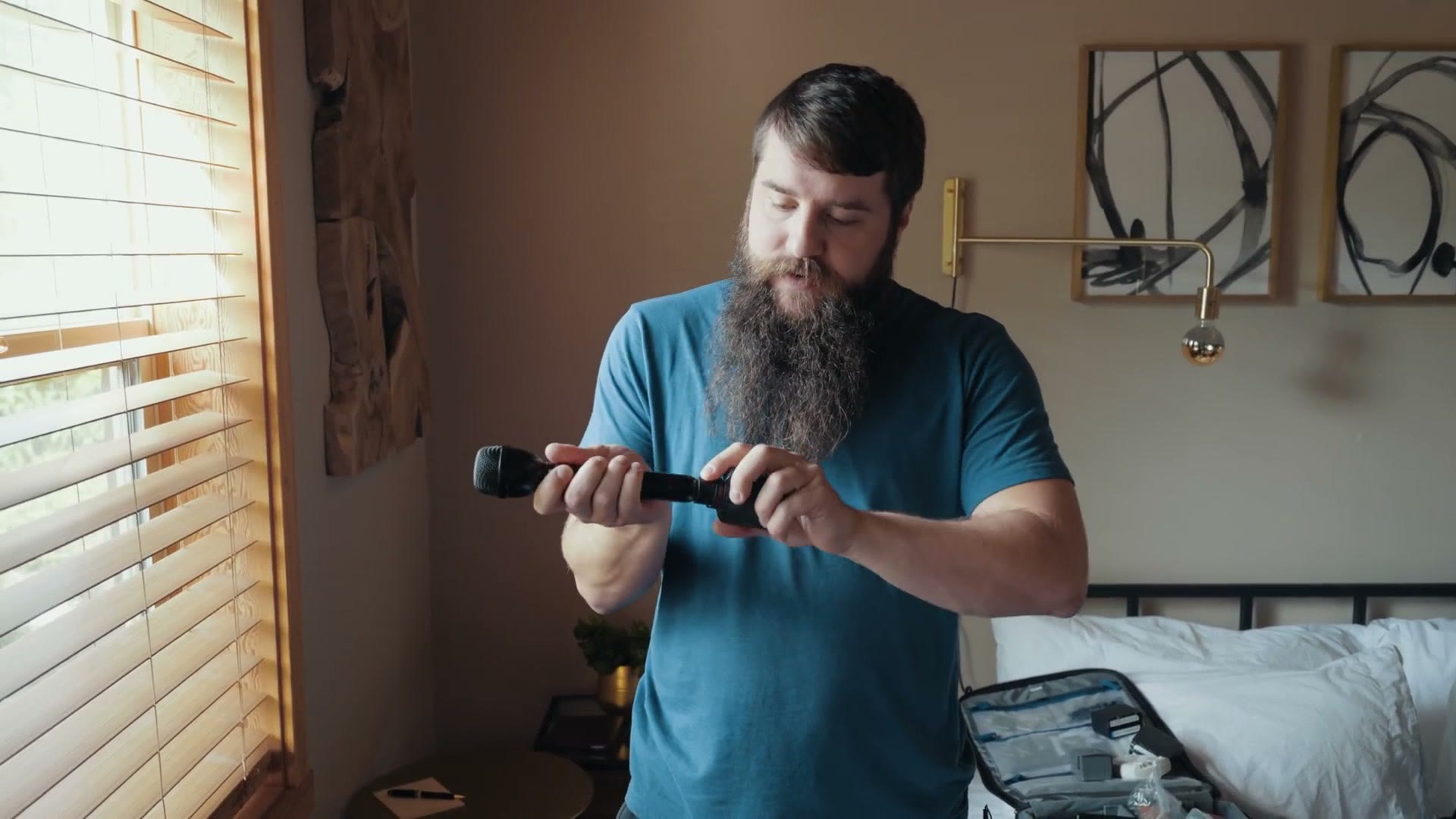 Matt assembling an Electro-Voice RE50/B handheld microphone with a Tascam DR-10X recorder screwed into the bottom of it.