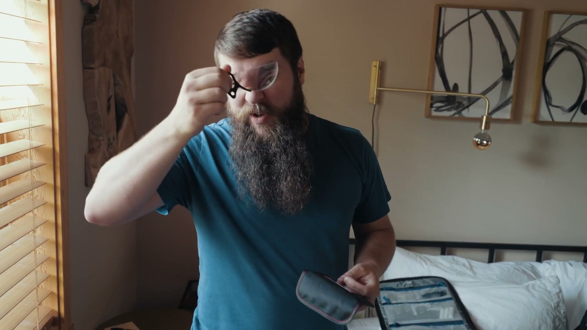 Matt holding a small split diopter filter up in front of his eye.