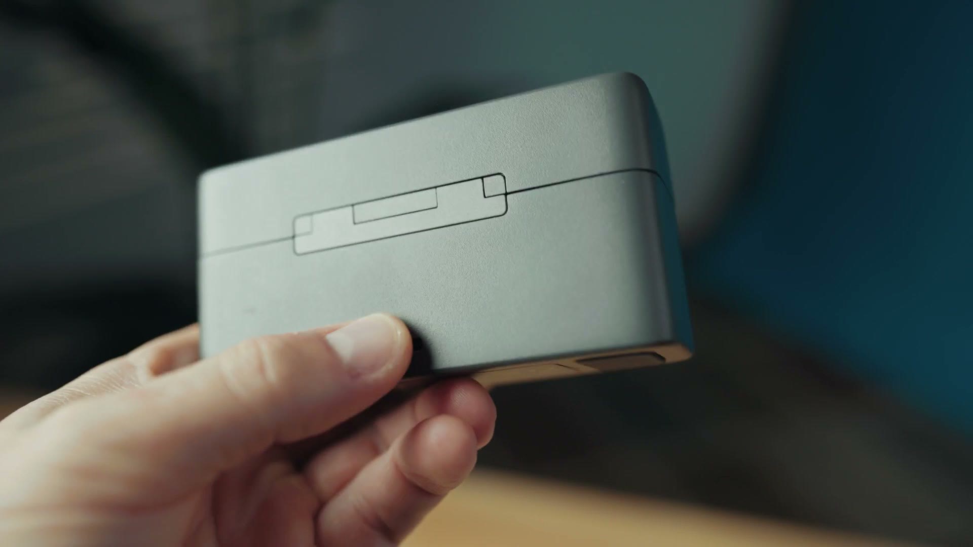 DJI Mic 2 charging case being held closed