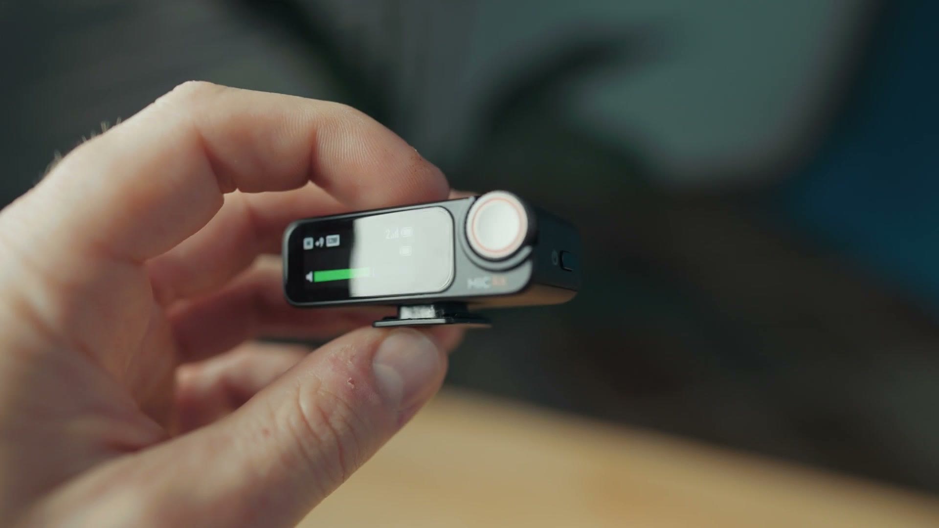 DJI Mic 2 receiver showing its small touchscreen