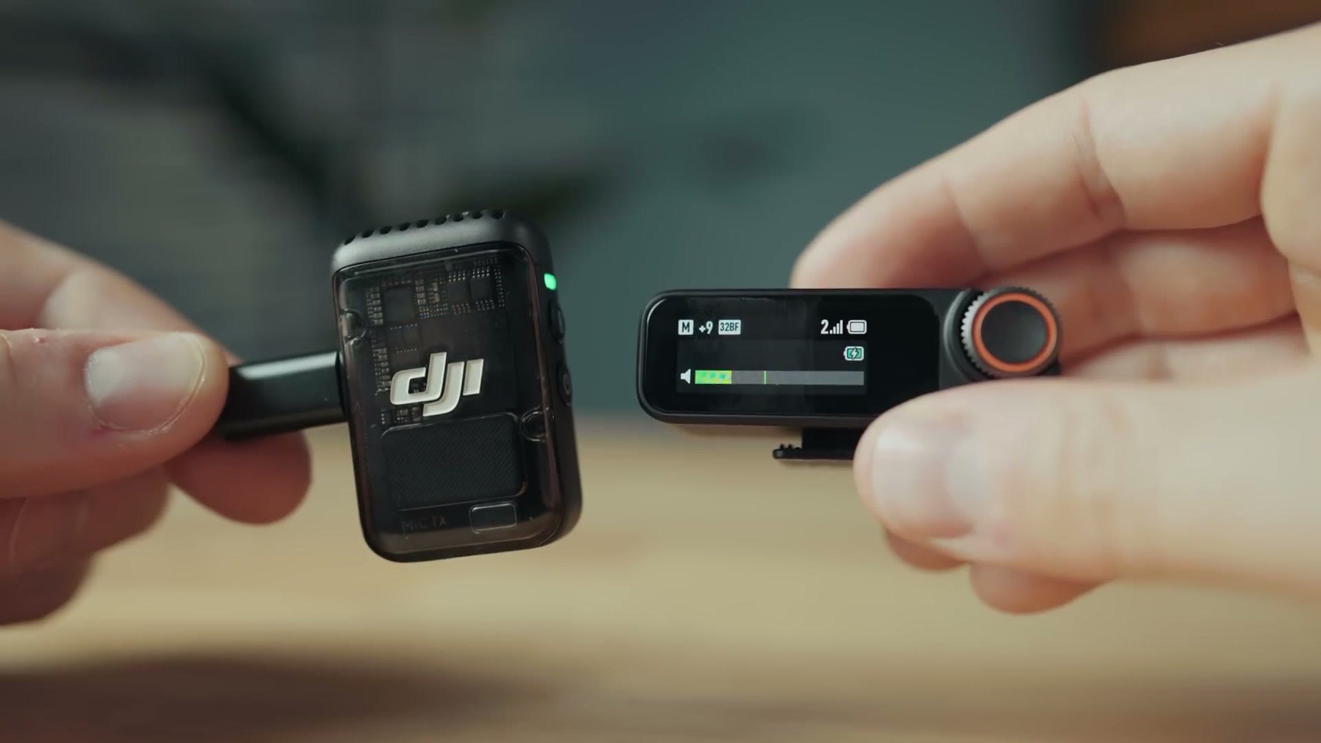 DJI Mic 2 transmitter and receiver held side by side
