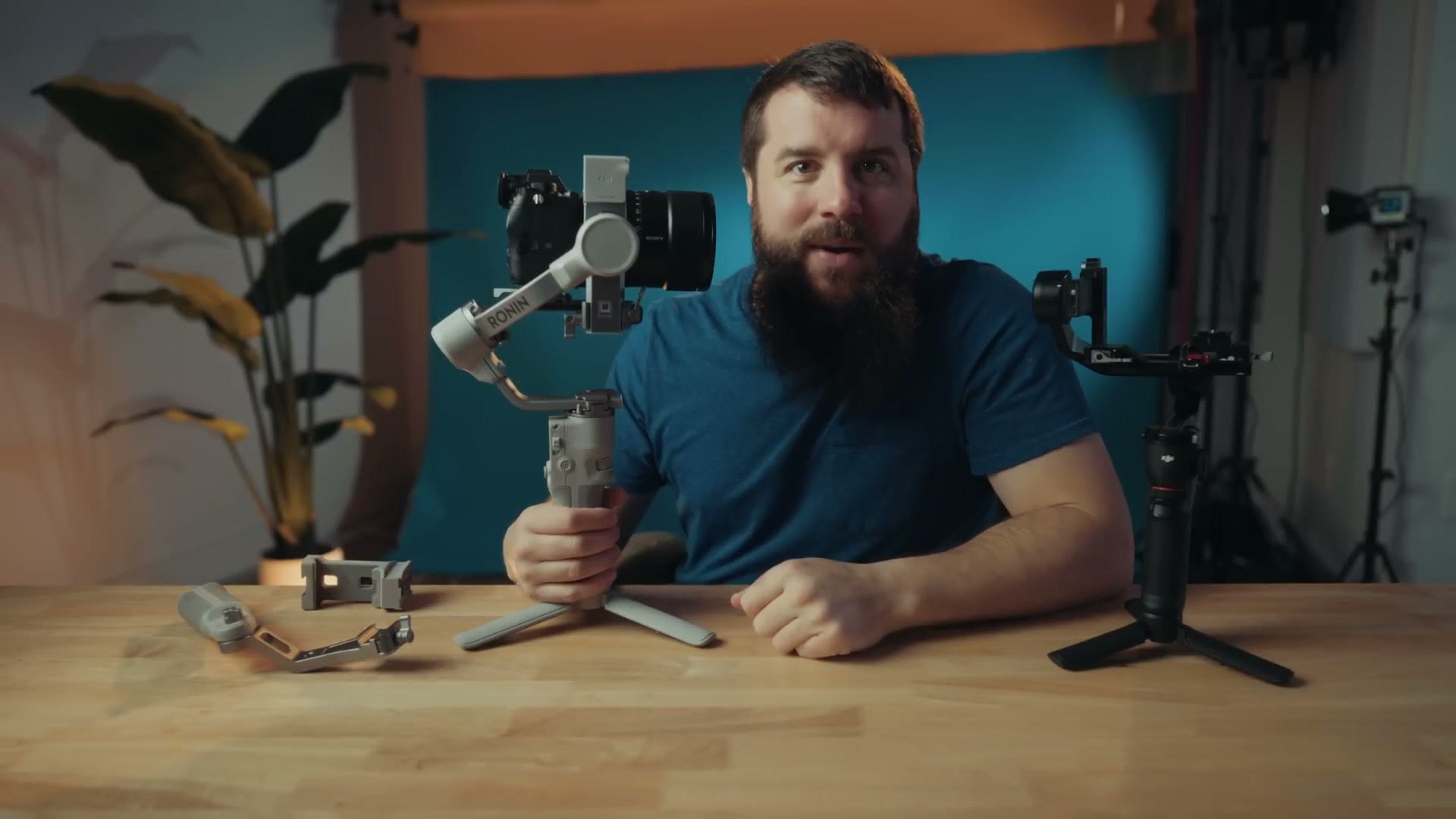 The RS Intelligent Tracking Module clicked onto the top of the white DJI RS4 Mini gimbal above the camera