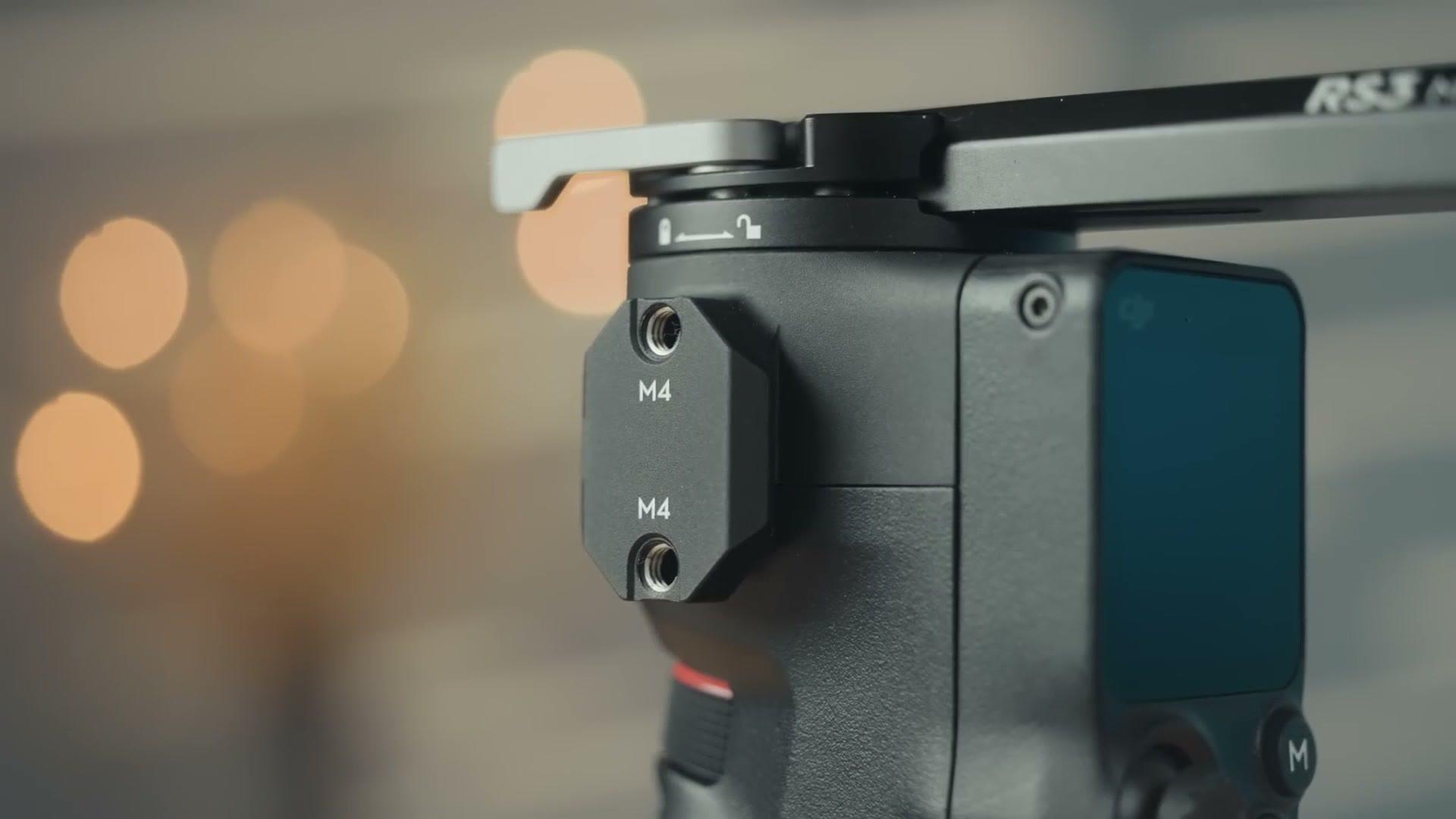 Close up of the M4 accessory mounting points on the side of the DJI RS 3 Mini