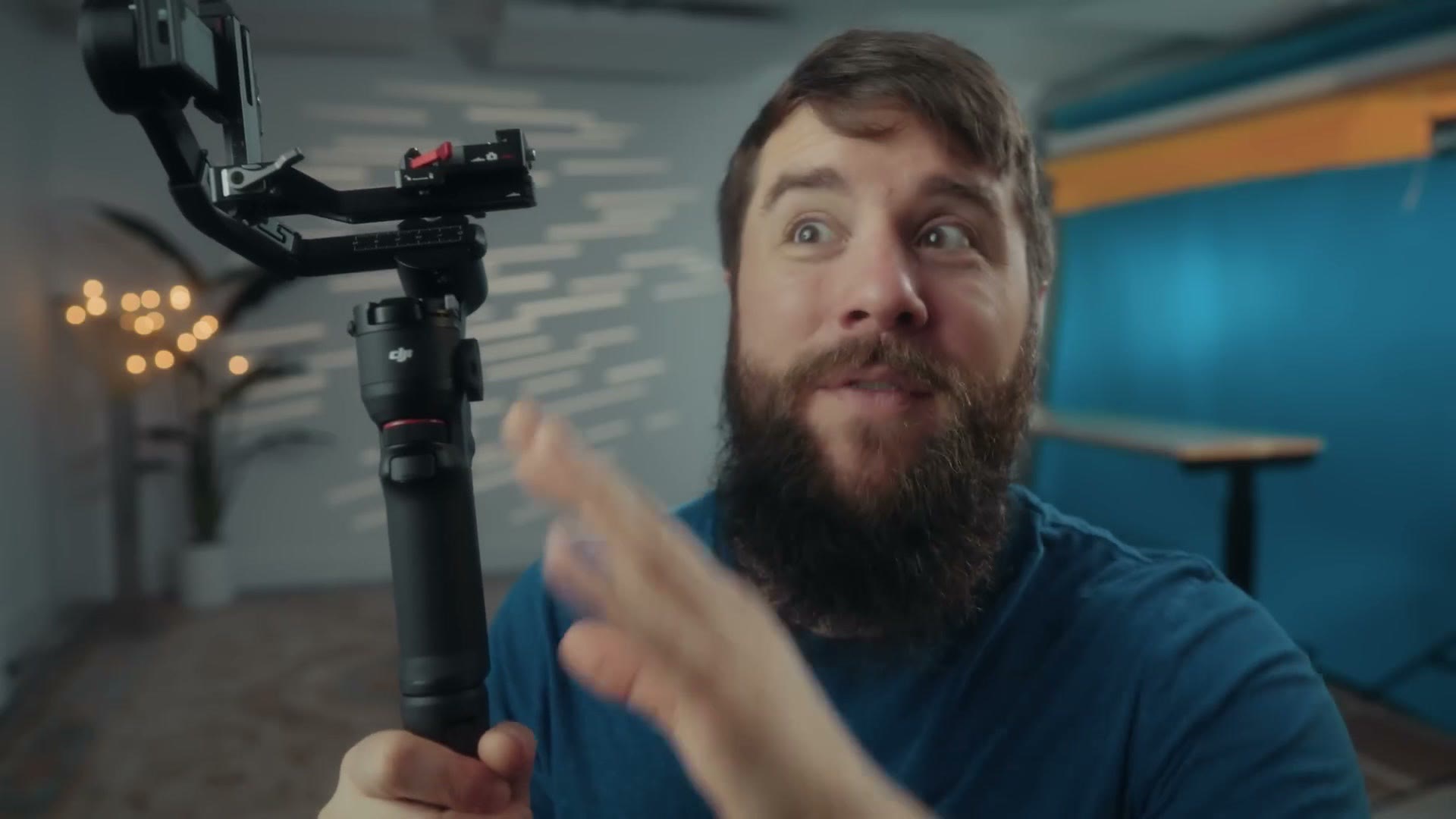 Matt Johnson holding the DJI RS 3 Mini gimbal with a camera mounted