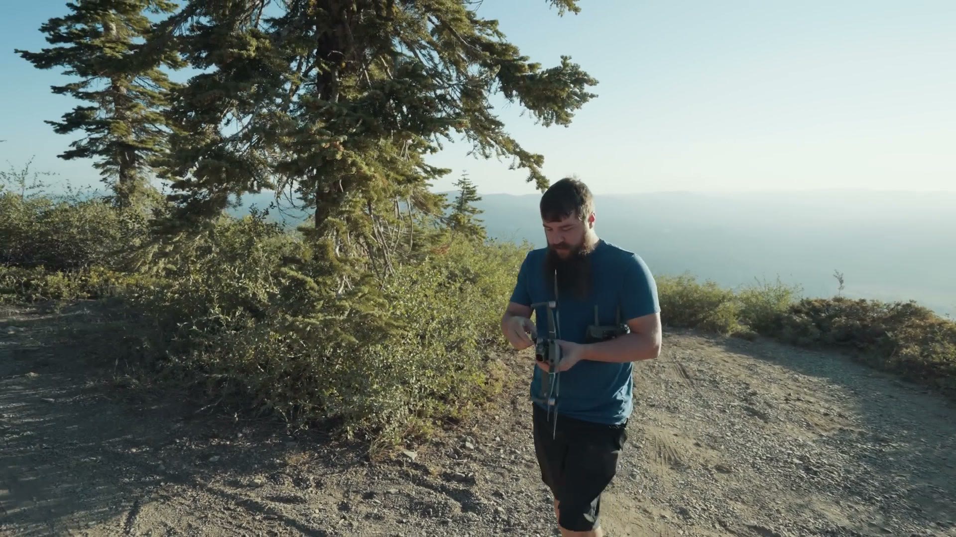 Matt Johnson flying a drone on the mountain ridge