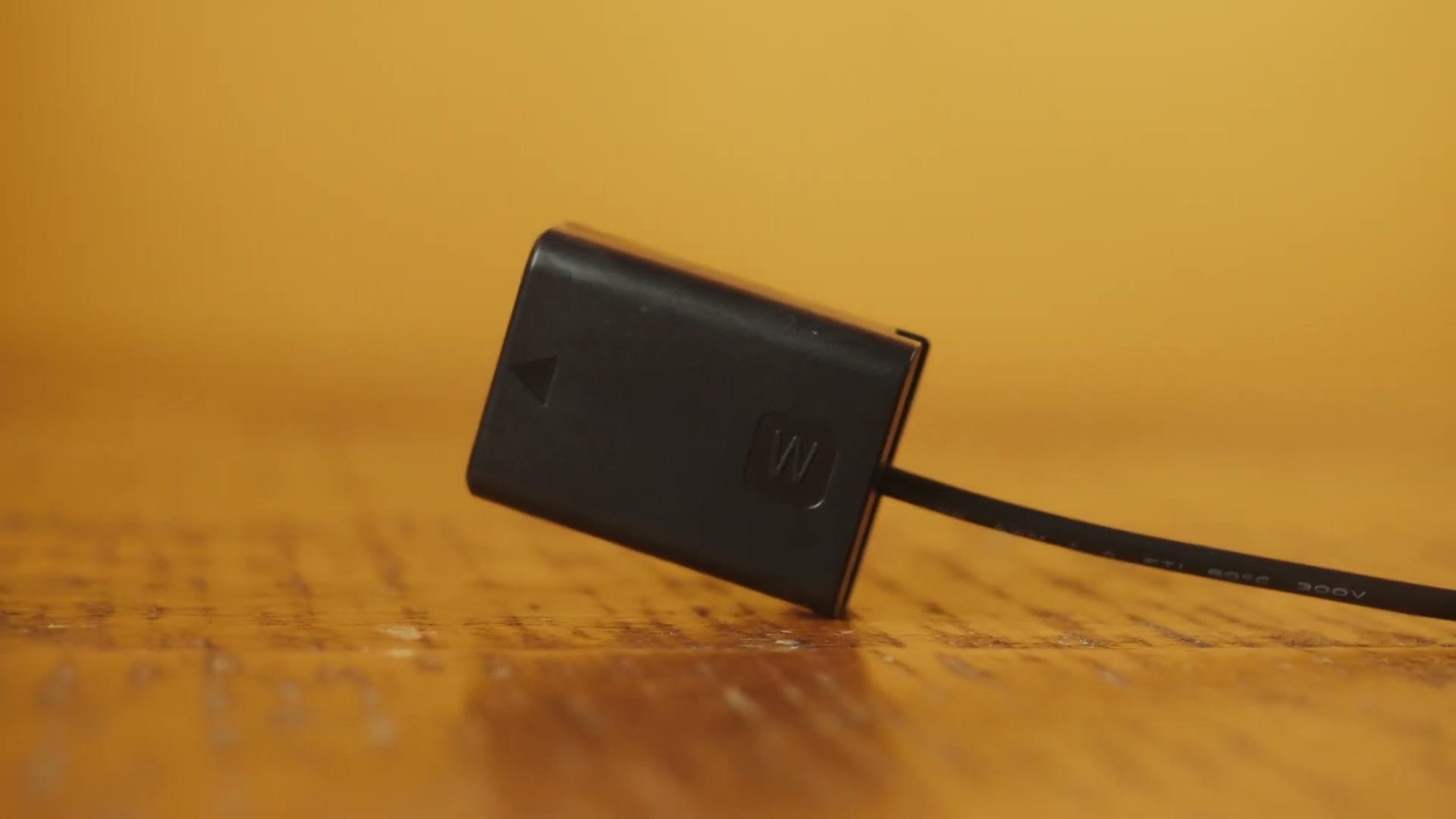 A dummy battery with a power cable running out of it